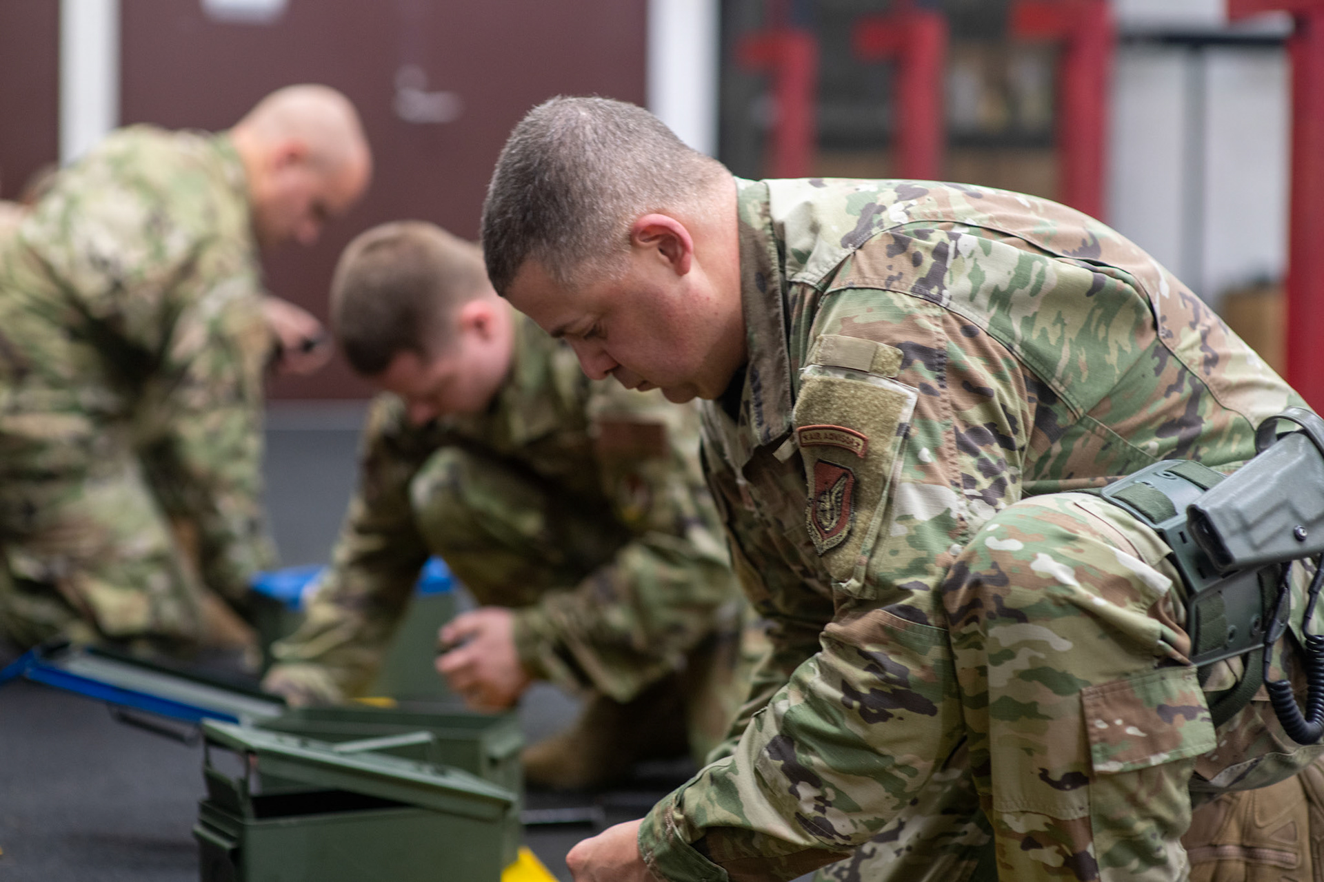 Col. Patrick Launey, front, 374th Mission Support Group commander, loads ammo into a magazine before an Excellent-In-Competition M9 Beretta pistol event at Yokota Air Base, Japan, April 12, 2022. The four-day competition was held to boost morale and test 165 active-duty military members on how accurate they can shoot their authorized duty pistols. The top 10% scorers will earn the Air Force Excellence In Competition medal to wear on the Service Dress Uniform. (U.S. Air Force photo by Yasuo Osakabe)