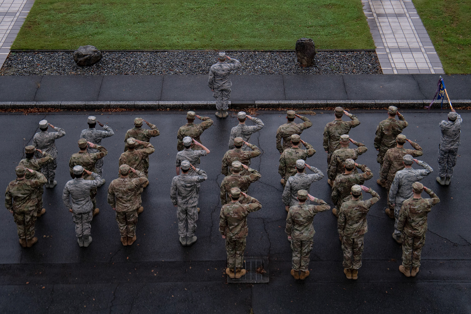 Members of the 374th Communications Squadron salute during a retreat ceremony Oct. 18, 2019, at Yokota Air Base, Japan. The retreat ceremony serves as a way to pay respect to the flag and signals the end of the official duty day with the playing of the U.S. national anthem while lowering and folding the flag. (U.S. Air Force photo by Yasuo Osakabe)