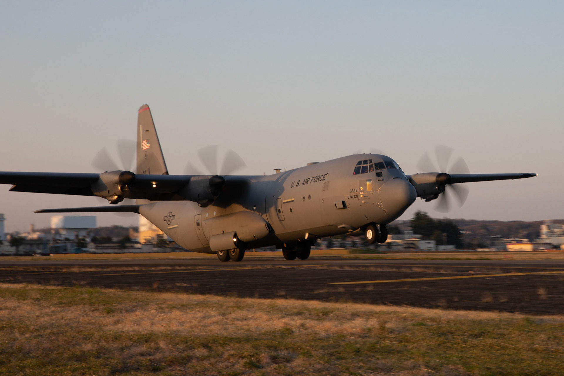 A C-130J Super Hercules assigned to the 36th Airlift Squadron takes off from Foxtrot taxiway at Yokota Air Base, Japan, March 26, 2020. A C-130J used Foxtrot taxiway here as a landing zone for an assault landing for the first time. Training like this ensures the mission can continue at the Yokota airfield despite any potential setbacks that impact operations to the main runway. (U.S. Air Force photo by Yasuo Osakabe)