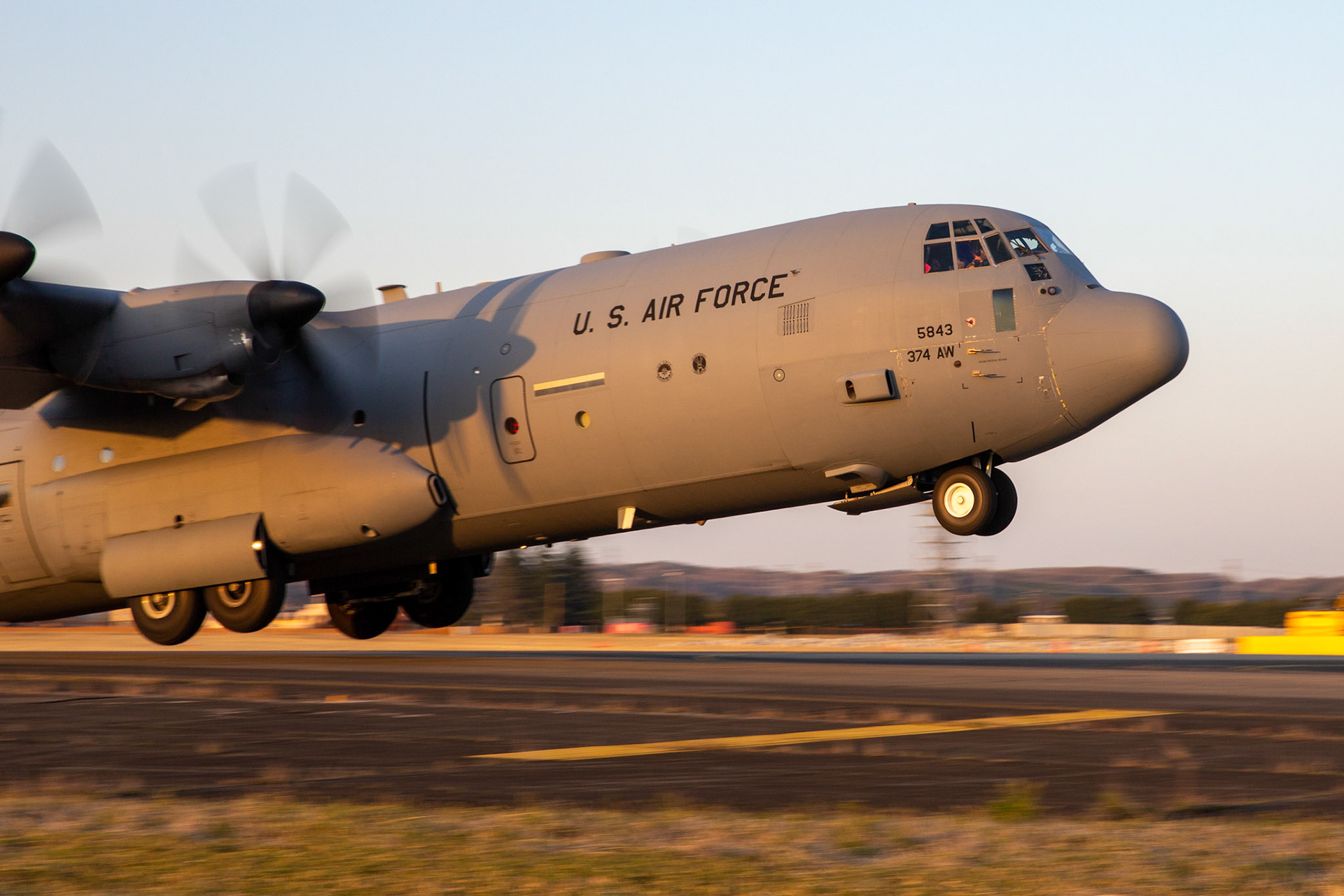 A C-130J Super Hercules assigned to the 36th Airlift Squadron takes off from Foxtrot taxiway at Yokota Air Base, Japan, March 26, 2020. A C-130J used Foxtrot taxiway here as a landing zone for an assault landing for the first time Training like this ensures the mission can continue at the Yokota airfield despite any potential setbacks that impact operations to the main runway. (U.S. Air Force photo by Yasuo Osakabe)