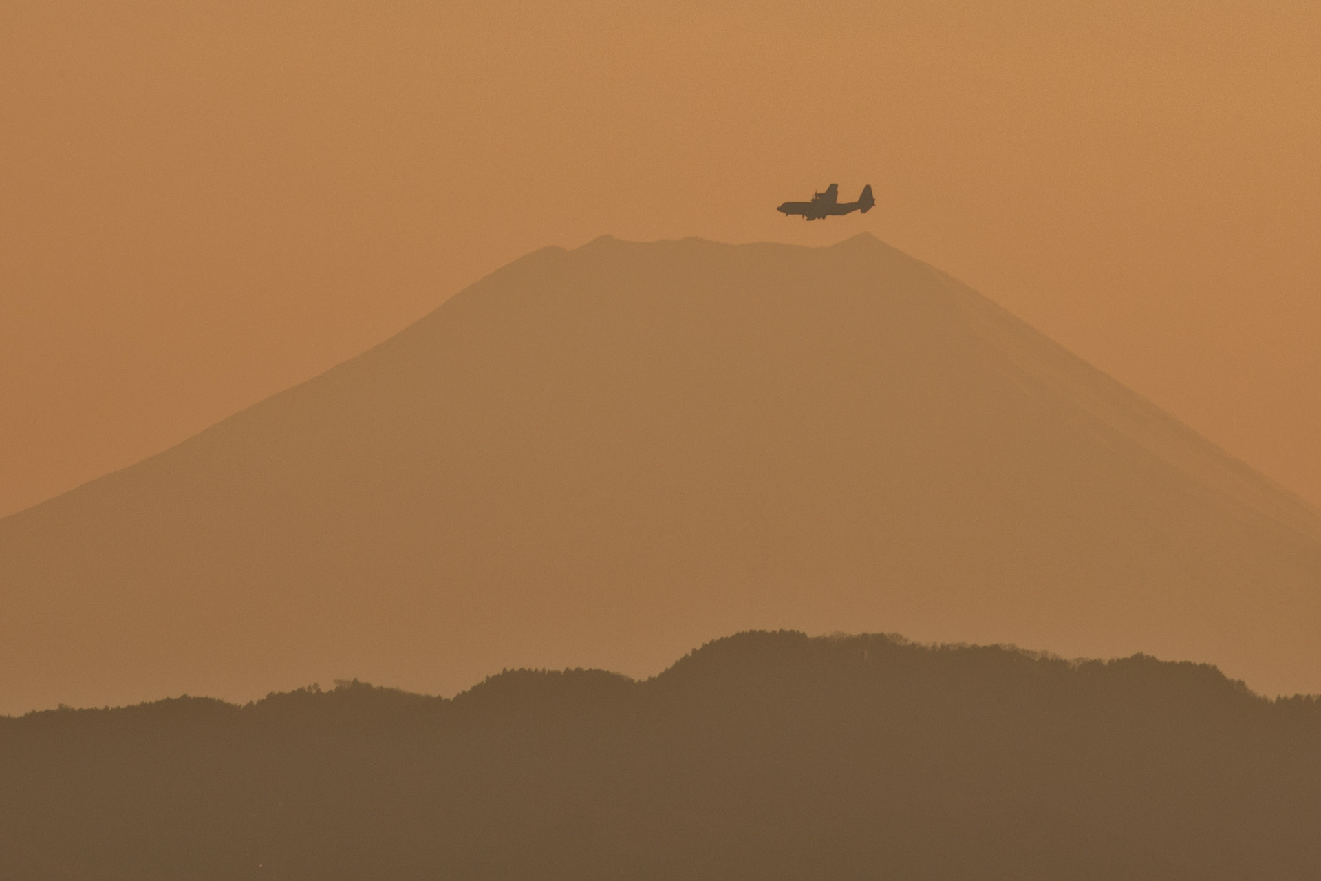 A C-130J Super Hercules assigned to the 36th Airlift Squadron conducts a daily training missions over Yokota Air Base, Japan, March 26, 2020. A C-130J used Foxtrot taxiway here as a landing zone for an assault landing for the first time. Training like this ensures the mission can continue at the Yokota airfield despite any potential setbacks that impact operations to the main runway. (U.S. Air Force photo by Yasuo Osakabe)