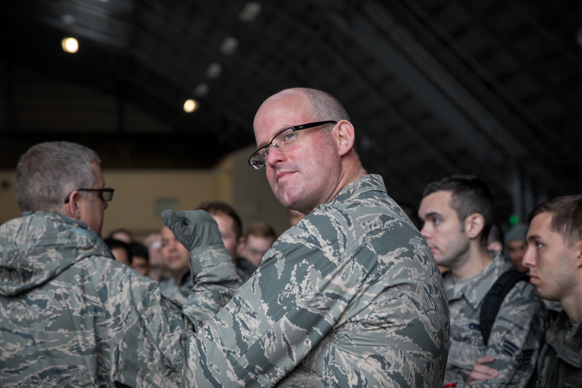 Maj. David Mueller, 374th Aircraft Maintenance Squadron commander, looks at the last C-130H Hercules during a speech at Yokota Air Base, Japan, Oct. 16, 2017. The 374th AMXS maintained 14 C-130H Hercules aircraft, which were responsible for the tactical airlift of an area of responsibility covering 50 percent of the globe. (U.S. Air Force photo by Yasuo Osakabe)