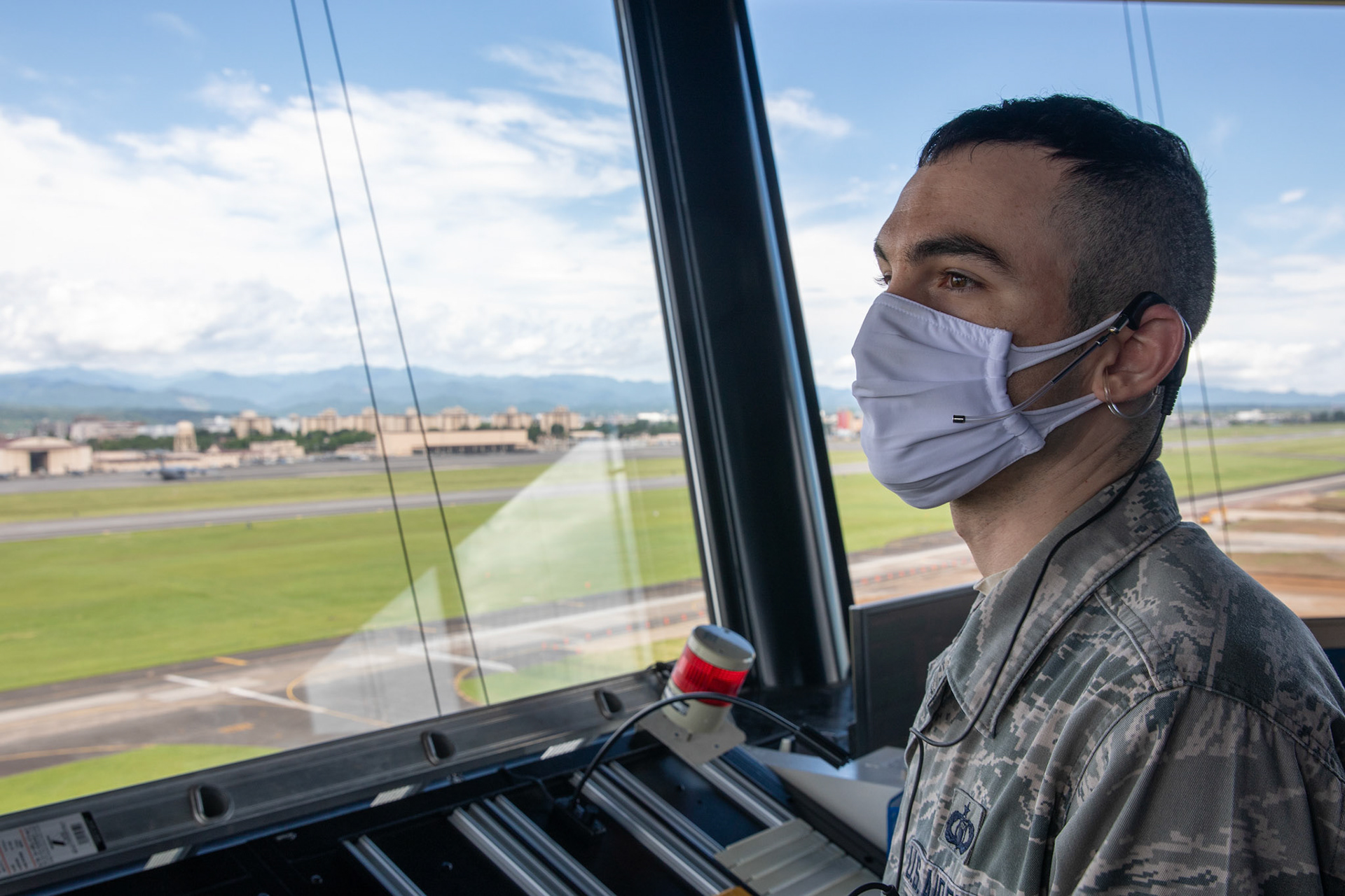 Tech. Sgt. Gregory Nitch, 374th Operations Support Squadron air traffic controller, monitors an aircraft at Yokota Air Base, Japan, June 11, 2020. Responsible for managing the flow of aircraft through all aspects of their flight, ATC specialists ensure the safety and efficiency of air traffic on the ground and in the air. (U.S. Air Force photo by Yasuo Osakabe)