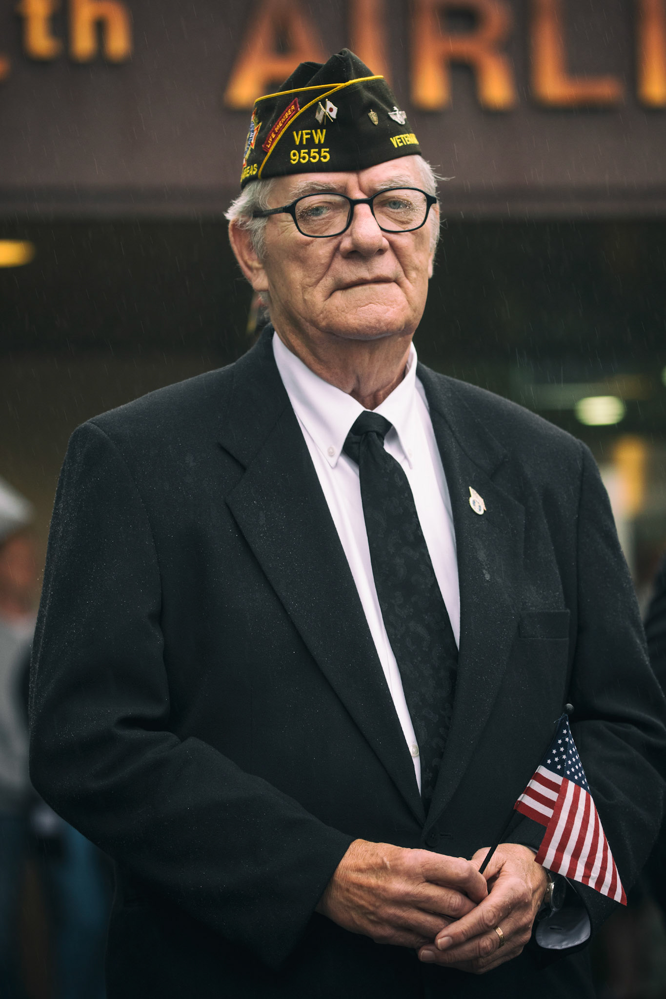 Retired U.S. Air Force Master Sgt. Bill Bilyk, Vietnam War veteran and member of the Veterans of Foreign War Post 9555, holds the American flag during the Memorial Day Ceremony at Yokota Air Base, Japan, May 26, 2016. The 374th Airlift Wing hosted the ceremony in memory of those who made the ultimate sacrifice during military service. (U.S. Air Force photo by Yasuo Osakabe)