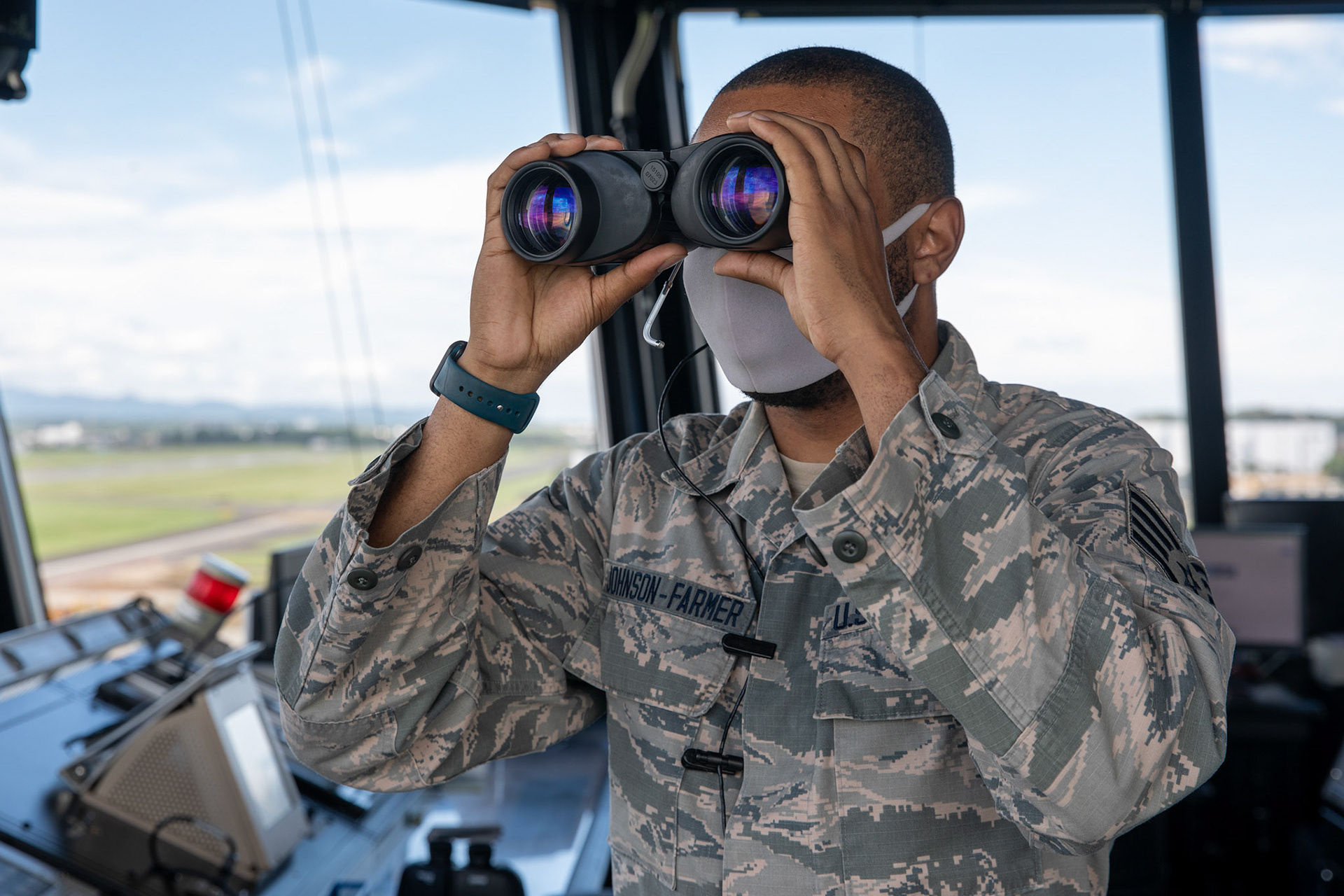 Staff Sgt. Brandon Johnson-Farmer, 374th Operations Support Squadron air traffic controller, looks for an inbound aircraft at Yokota Air Base, Japan, June 11, 2020. ATC Airmen are responsible for the safety and control of hundreds of military and civilian aircraft everyday. (U.S. Air Force photo by Yasuo Osakabe)