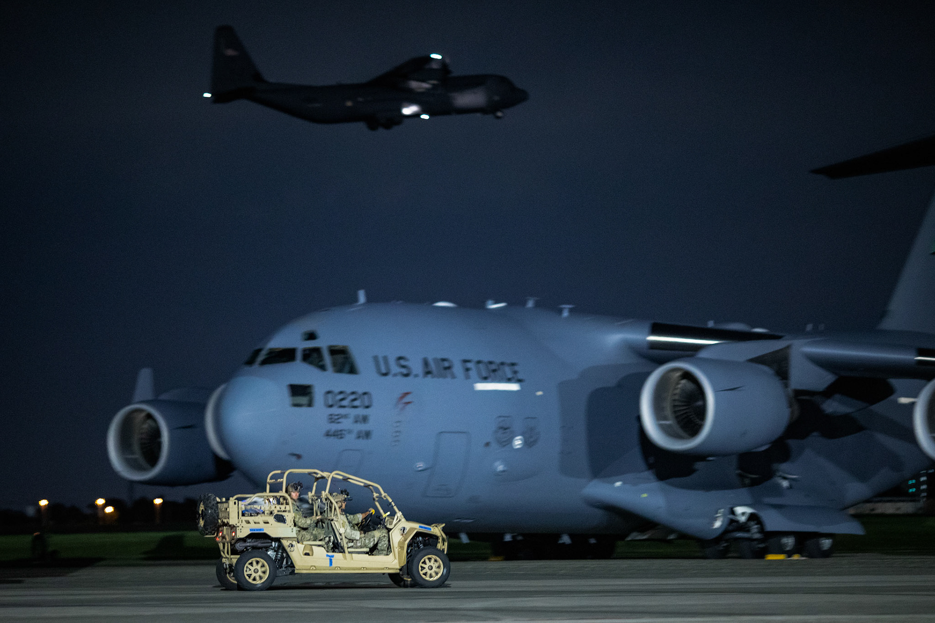Air Force Special Tactics operators with the 320th Special Tactics Squadron out of Kadena Air Base, Japan, offload a tactical vehicle from a C-130J Super Hercules during an engine running onload/offload (ERO) training a part of Exercise Gryphon Jet at Yokota Air Base, Japan, June 23, 2020. Special Tactics is a U.S. Special Operation Command's tactical air and ground integration force, and the Air Force's special operations ground force, leading Global Access, Precision Strike, Personnel Recovery and Battlefield Surgery operations on the battlefield. The Exercise Gryphon Jet is an integrated training exercise focused on improving interoperability throughout the special operations community. (U.S. Air Force photo by Yasuo Osakabe)