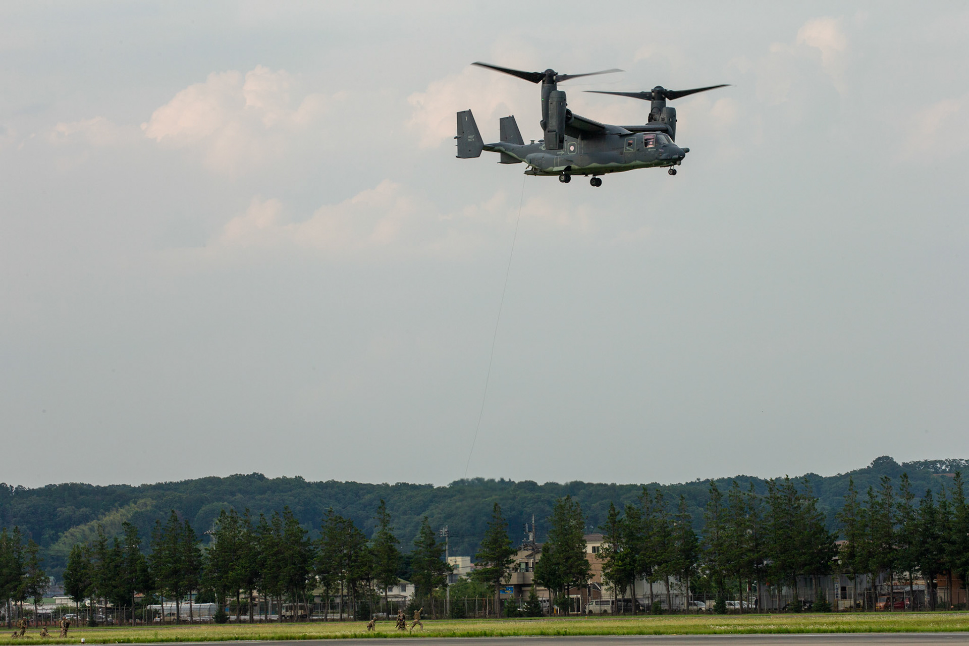 U.S. Special Operations Forces operators prepare to repel onto the flightline from a U.S. Air Force CV-22 Osprey assigned to the 21st Special Operations Squadron during Exercise Gryphon Jet at Yokota Air Base, Japan, June 15, 2020. Gryphon Jet is an integrated training exercise focused on improving interoperability throughout the special operations community. (U.S. Air Force photo by Yasuo Osakabe)