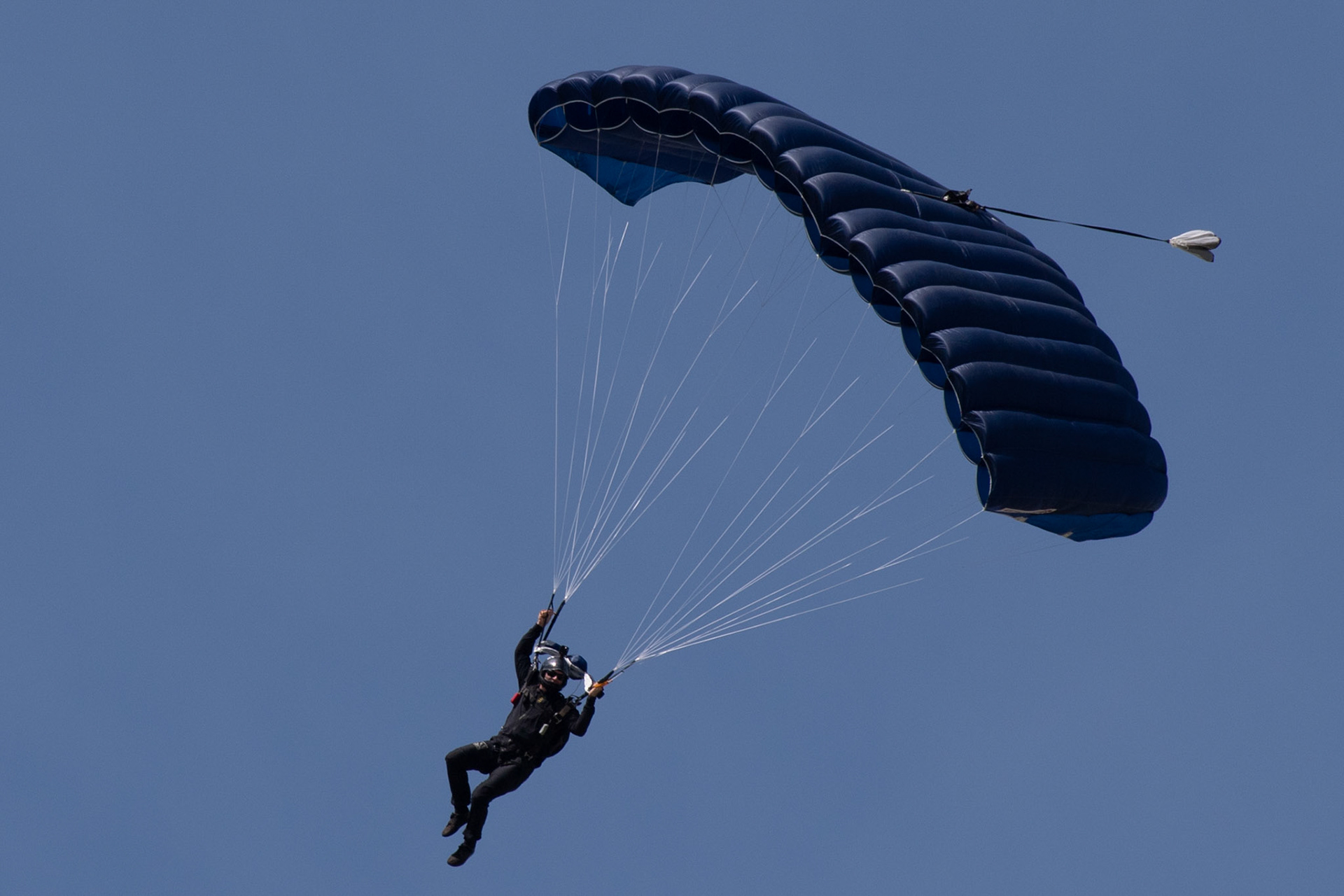 A member of U.S. Navy SEAL (Sea, Air and Land) Team One parachutes from a U.S. Air Force C-130J Super Hercules assigned to the 36th Airlift Squadron over Yokota Air Base, Japan, June 17, 2020, during Exercise Gryphon Jet. Gryphon Jet is an integrated training exercise focused on improving interoperability throughout the special operations community. (U.S. Air Force photo by Yasuo Osakabe)