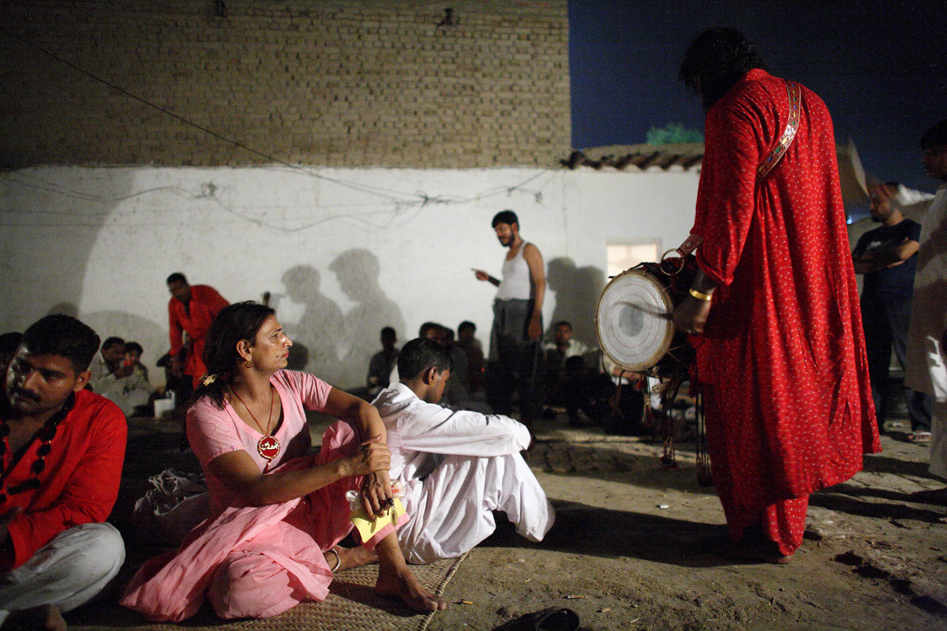 He(wore the pink punjabi dress) was all ears in the sufi beat in the pilgrims encampment, from Lahore, Punjab, near the shrine of Hazrat Lal Shahbaz Qalandar.(Travel)