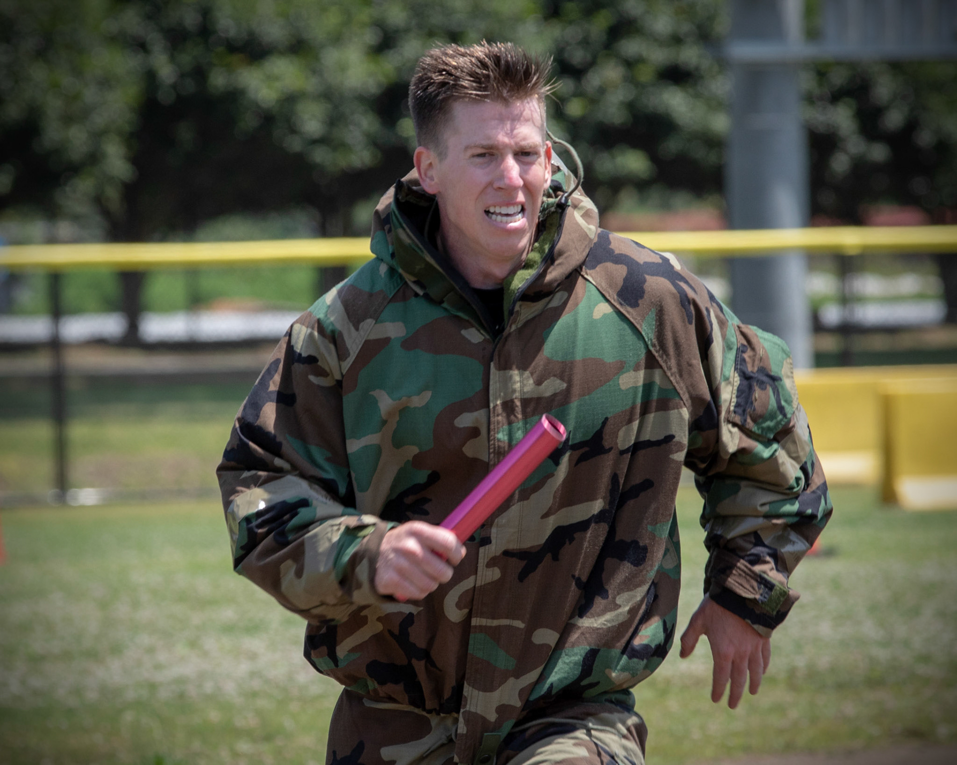Staff Sgt. Daniel Lanata, 374th Security Forces Squadron patrolman, sprints toward the finish line during an Ability to Survive and Operate (ATSO) Rodeo at Yokota Air Base, Japan, June 8, 2018. The rodeo involved participants wearing different stages of mission-oriented protective posture (MOPP) gear after pushing a Humvee and going through various areas of training including self-aid and buddy care, post-attack reconnaissance, four-person relay, and "shoot, move and communicate." (U.S. Air Force photo by Yasuo Osakabe)