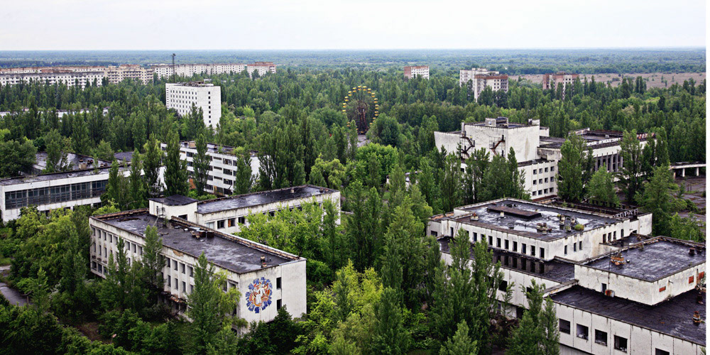 Pripyat is an abandoned city in the zone of alienation in northern Ukraine, Kiev Oblast, near the border with Belarus. The city was founded in 1970 to house the Chernobyl Nuclear Power Plant workers, and was abandoned in 1986 following the Chernobyl disaster. Its population had been around 50,000 prior to the accident. This view is from 16-storeyed building near by the center of Pripyat town.