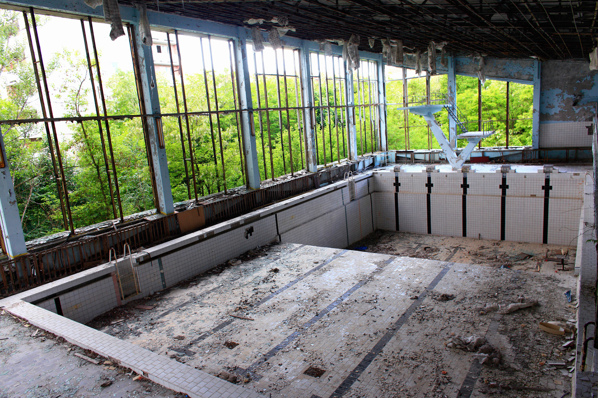 Just 23 years ago, people who live in Pripyat city enjoyed swimming and jumping into the water.23 years after now, just empty with a jagged shards of glass.