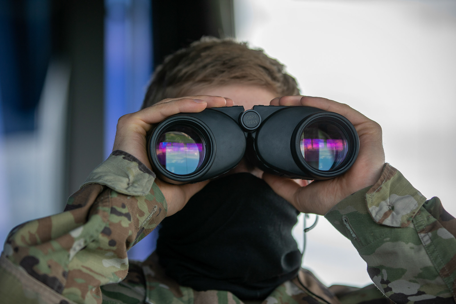 Staff Sgt. Cameron Freeman, 374th Operations Support Squadron air traffic controller, looks  out at aircraft taxing on the runway at Yokota Air Base, Japan, June 11, 2020. ATC airmen are responsible for the safety and control of hundreds of military and civilian aircraft everyday. (U.S. Air Force photo by Yasuo Osakabe)