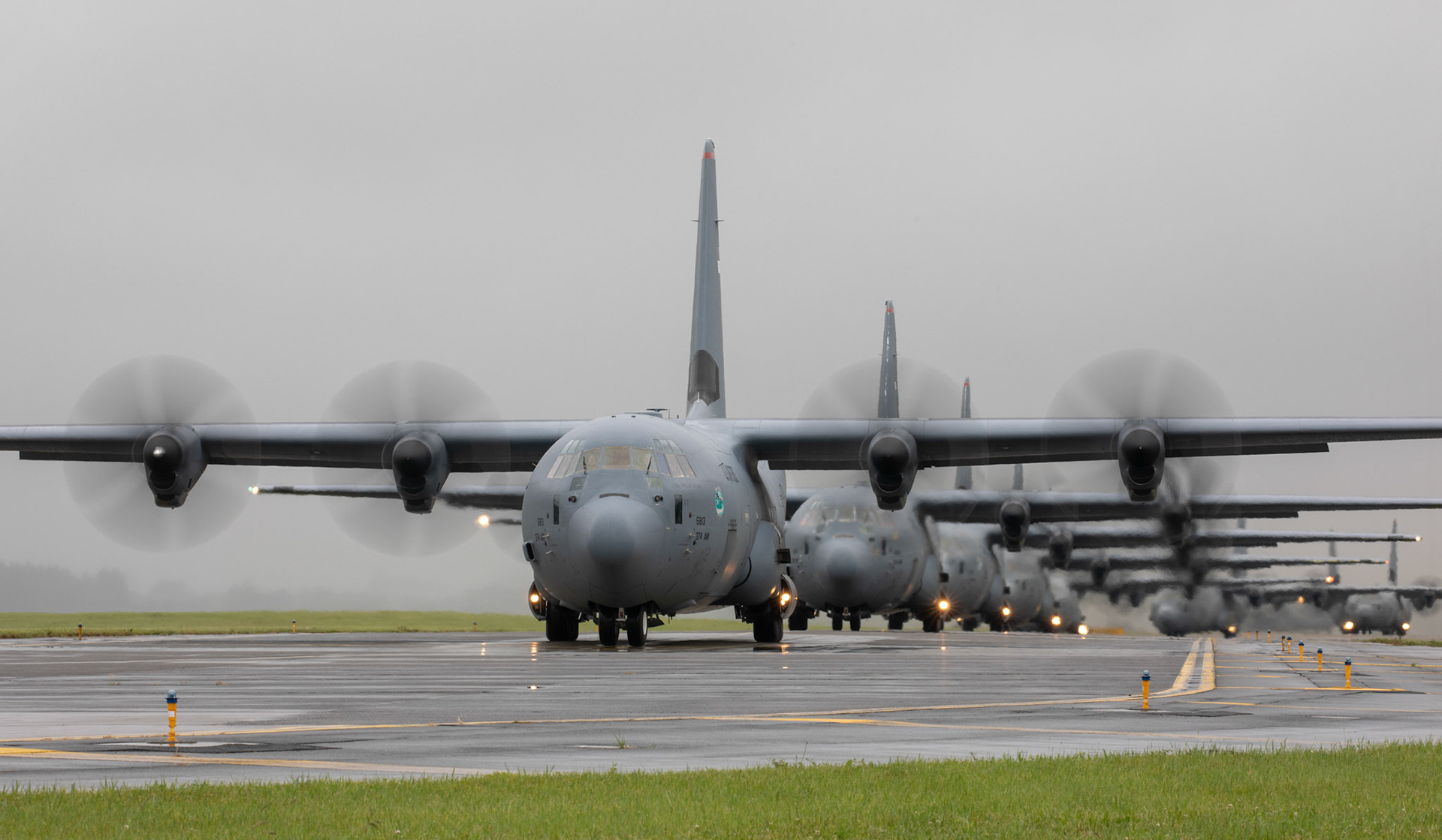 Seven C-130J Super Hercules' assigned to the 36th Airlift Squadron taxi on the runway at Yokota Air Base, Japan, May 21, 2020, during the Samurai Surge training exercise. The 374th AW operates a mission fleet of C-130J Super Hercules, C-12 Hurons and UH-1N Iroquois as the primary Western Pacific airlift hub for U.S. Air Force peacetime and contingency operations.(U.S. Air Force photo by Yasuo Osakabe)