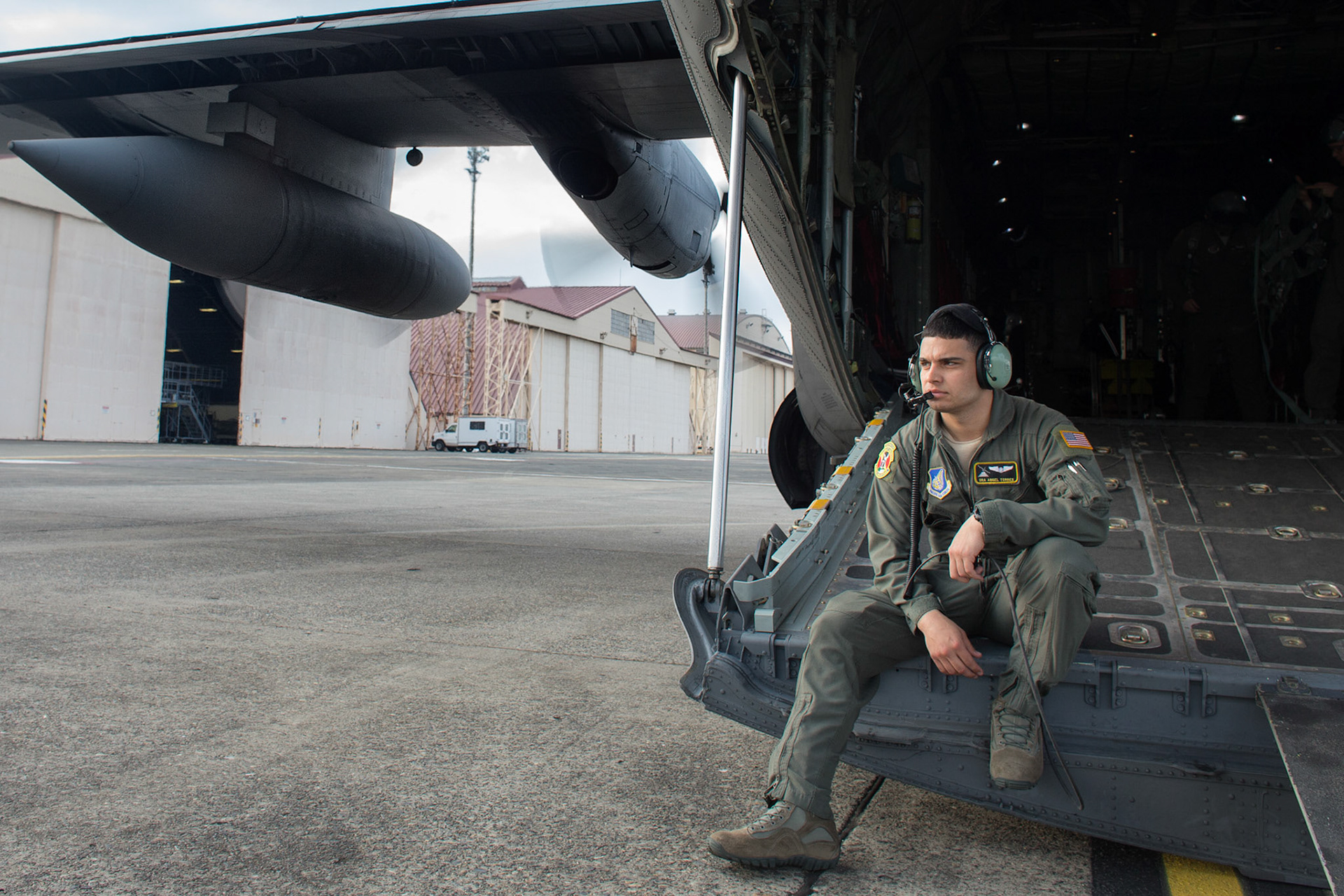 U.S. Air Force Senior Airman Angel Torres, 36th Airlift Squadron C-130 loadmaster, waits for U.S. Marines jumpers on board at Yokota Air Base, Japan, March 23, 2017, during jump week. The training not only allowed the Marines to practice jumping, but it also allowed the Yokota aircrews to practice flight tactics and timed-package drops day and night. (U.S. Air Force photo by Yasuo Osakabe)