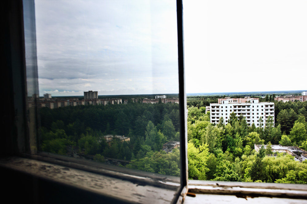 Pripyat city is reflected to an appartment window.