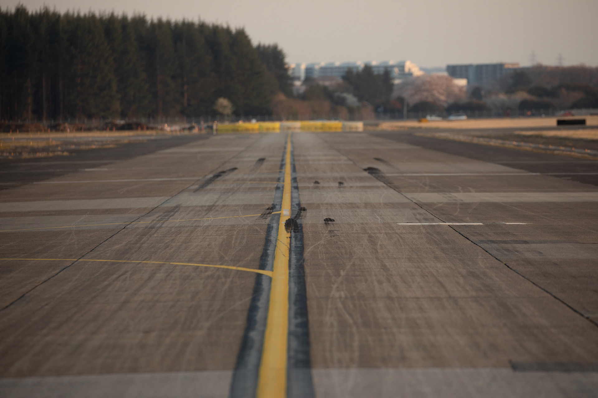 It is the first landing wheel tire tracks on the Foxtrot runway after a C-130J Super Hercules landing at Foxtrot Taxiway, Yokota Air Base, Japan, March 26, 2020.  A C-130J used Foxtrot taxiway here as a landing zone for an assault landing for the first time. Training like this ensures the mission can continue at the Yokota airfield despite any potential setbacks that impact operations to the main runway. (U.S. Air Force photo by Yasuo Osakabe)