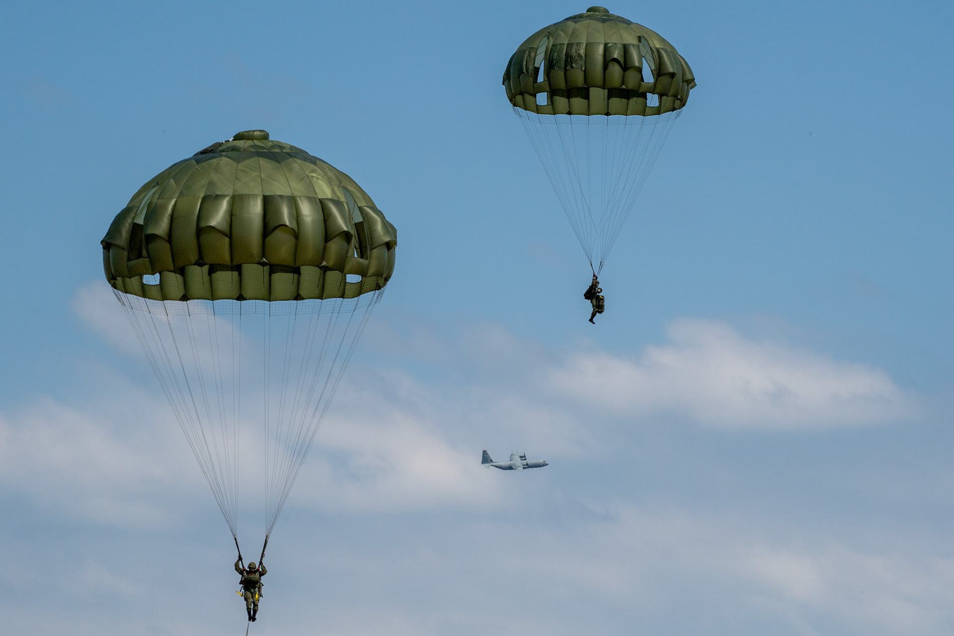 Japan Ground Self-Defense Force paratroopers assigned to the 1st Airborne Brigade descend from a U.S. Air Force C-130J Super Hercules assigned to the 36th Airlift Squadron during Field Training Exercise Iron Fist 23 over Kikaijima Island, Japan, March 3, 2023. During the exercise, the USAF and Japan Self-Defense Forces conducted simulated island seizure airborne operations as the U.S. Marine Corps performed a simultaneous amphibious assault onto the beachhead. (U.S. Air Force photo by Yasuo Osakabe)