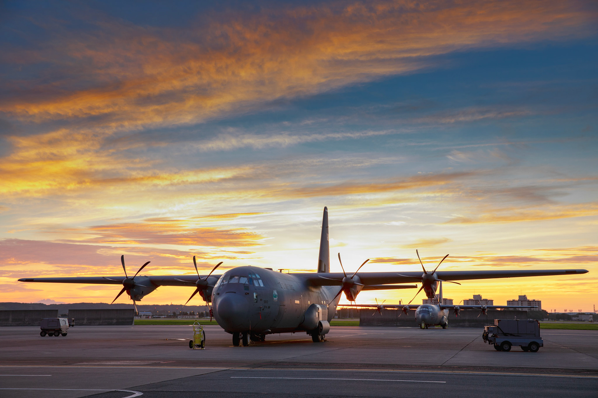 The early morning sunrise highlights a C-130J Super Hercules assigned to the 36th Airlift Squadron at Yokota Air Base, Japan, Aug. 15, 2018.  A colorful sky around sunrise means a lot of water vapor already present in the atmosphere. (U.S. Air Force photo by Yasuo Osakabe)
