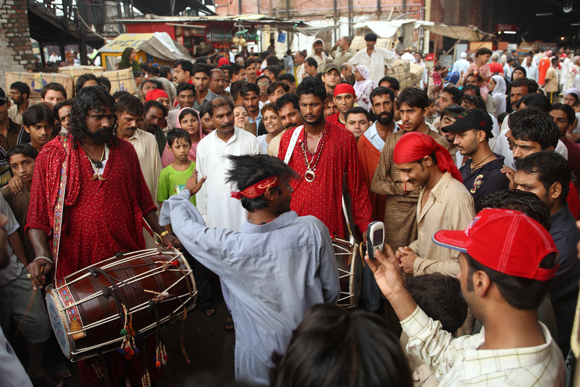 Gonga Sain(Left) and Mithu sain(Right) played the sufi beat and devotee danced for everyone to have a great journey at the concourse, Lahore Railway Station, Pakistan, before departure. (Travel)