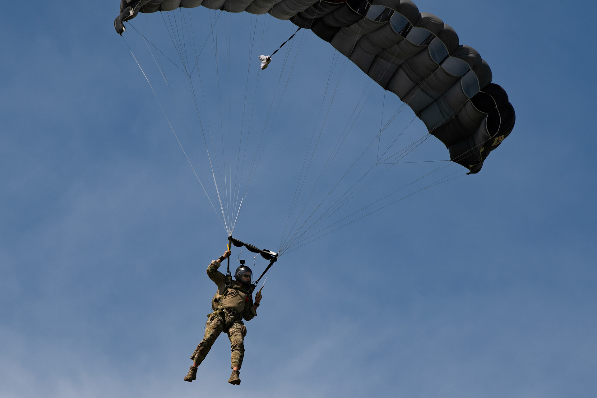 U.S. Air Force Tech Sgt. Seth Sarrett, 374th Operations Support Squadron survival, evasion, resistance and escape specialist, parachutes from a C-130J Super Hercules over Yokota Air Base, Japan, June 17, 2020, during Exercise Gryphon Jet. Gryphon Jet is an integrated training exercise focused on improving interoperability throughout the special operations community. (U.S. Air Force photo by Yasuo Osakabe)