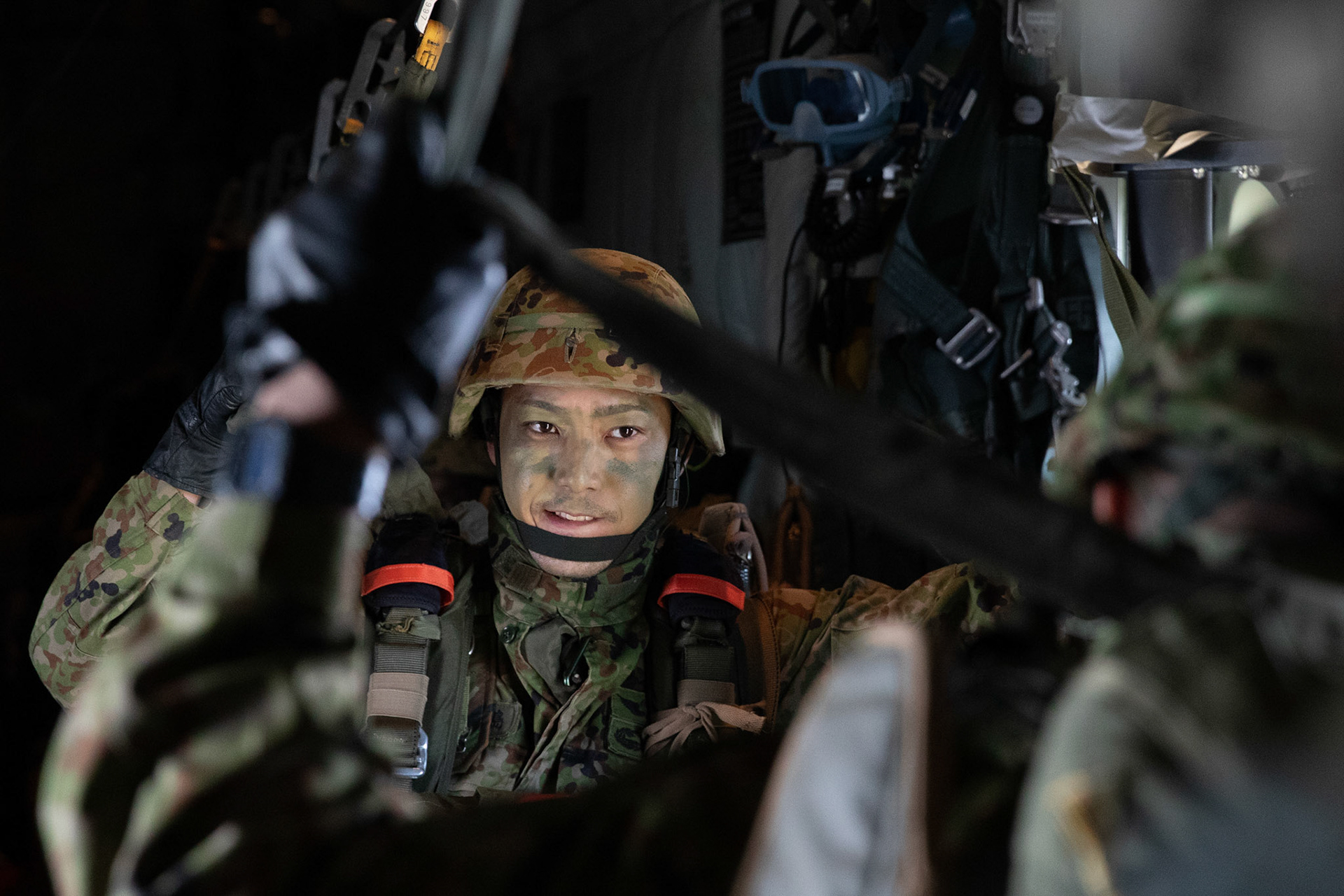 A Japan Ground Self-Defense Force soldier assigned to the 1st Airborne Brigade waits to jump from a U.S. Air Force C-130J Super Hercules assigned to the 36th Airlift Squadron over Hiju-dai drop zone, Oita prefecture, Japan, Nov. 4, 2018, during Keen Sword 19. Approximately 280 JGSDF personnel conducted jump training from U.S. Air Force C-130J Super Hercules’ for the first time in Japan. (U.S. Air Force photo by Yasuo Osakabe)