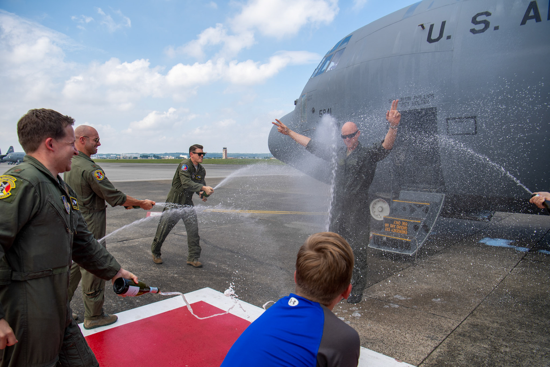 Col. Barry King, 374th Operations Group deputy commander, is greeted by family and colleagues after his final flight at Yokota Air Base, Japan, July 23, 2019. The fini-flight is a time-honored military aviation tradition marking the last flight of an aircrew member with a unit. (U.S. Air Force photo by Yasuo Osakabe)