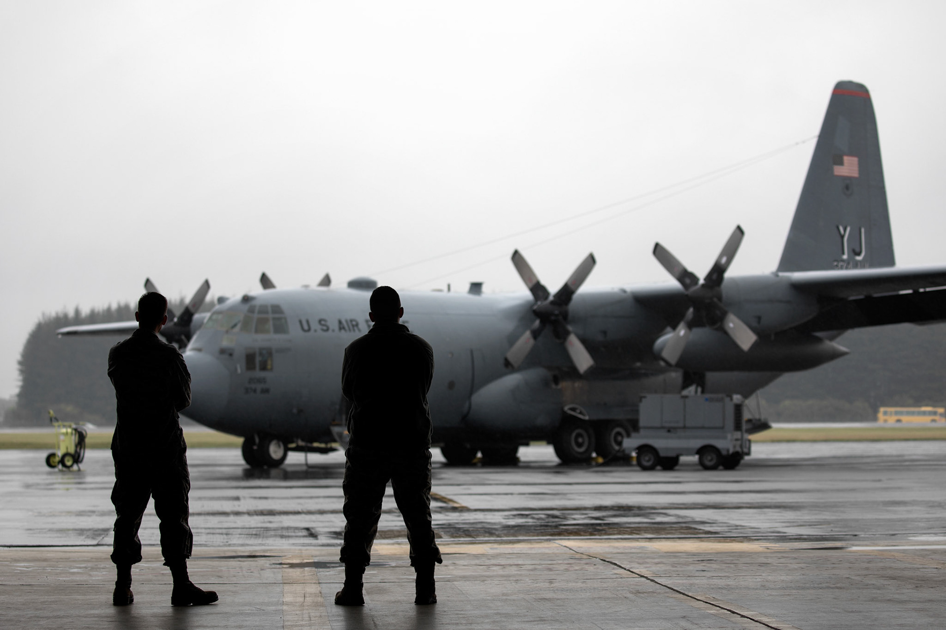 Crew chiefs with the 374th Aircraft Maintenance Squadron look at a C-130H Hercules after the official C-130H farewell ceremony at Yokota Air Base, Japan, Oct. 16, 2017. Yokota was the last base with C-130Hs in its active-duty inventory. (U.S. Air Force photo by Yasuo Osakabe)