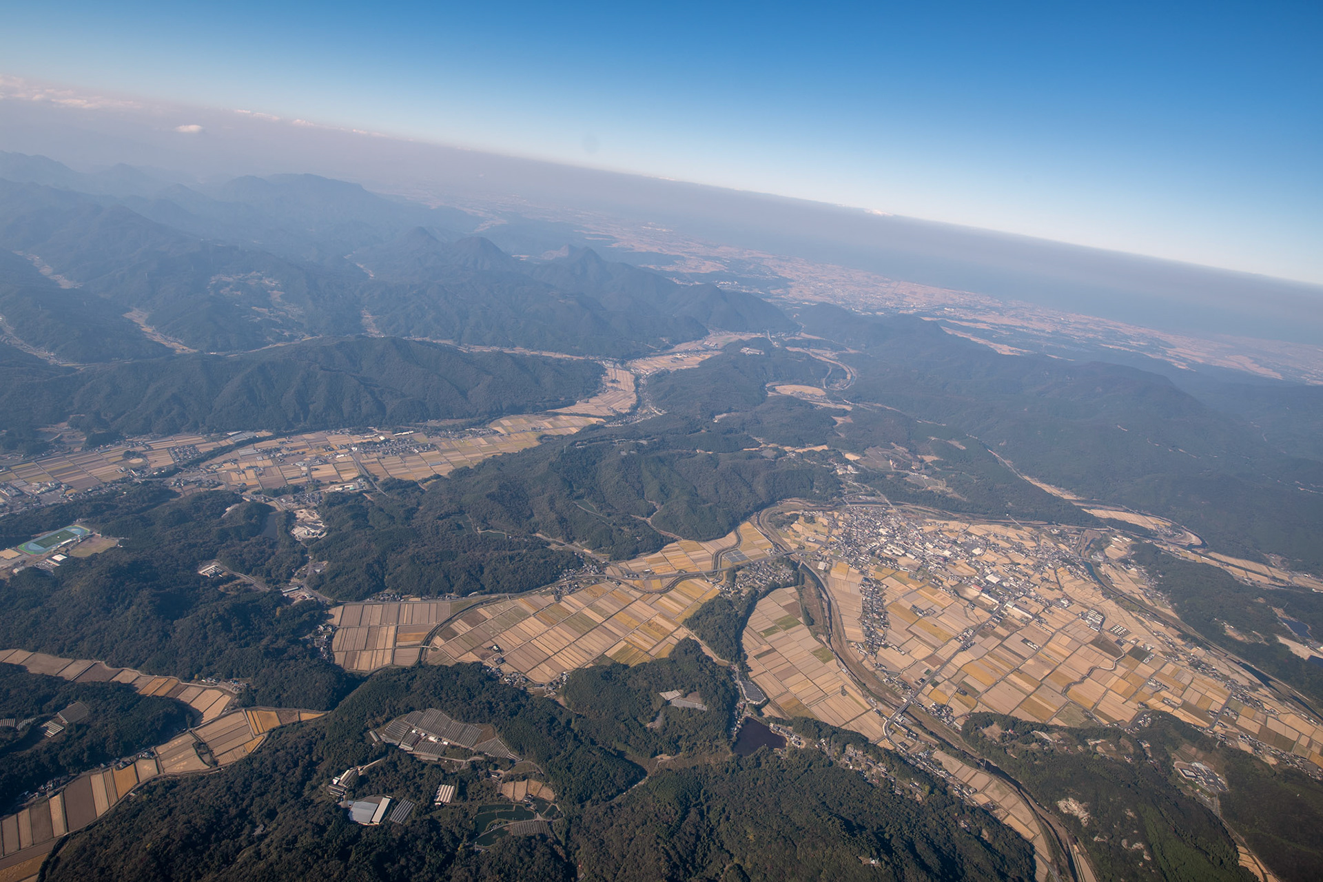 An aerial view of Oita prefecture from an Air Force C-130J Super Hercules assigned to the 36th Airlift Squadron, Nov. 4, 2018, during Keen Sword 19. Keen Sword is a concrete example of the strength of the U.S.-Japan alliance, the foundation of peace and security in the Indo-Pacific region for almost 60 years. The relationships that are built and maintained during these events are critical to the shared capability to respond to contingencies at a moment’s notice. (U.S. Air Force photo by Yasuo Osakabe)