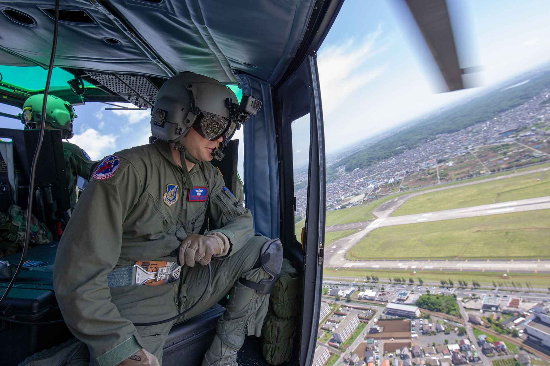 Tech. Sgt. Nicholas Poe, 459th Airlift Squadron special missions aviator, communicates with his crewmembers during the 374th Airlift Wing Generation Exercise at Yokota Air Base, Japan, May 4, 2018. This part of the exercise was conducted in order to demonstrate the wing’s ability to complete a formation flight with multiple aircraft. (U.S. Air Force photo by Yasuo Osakabe)