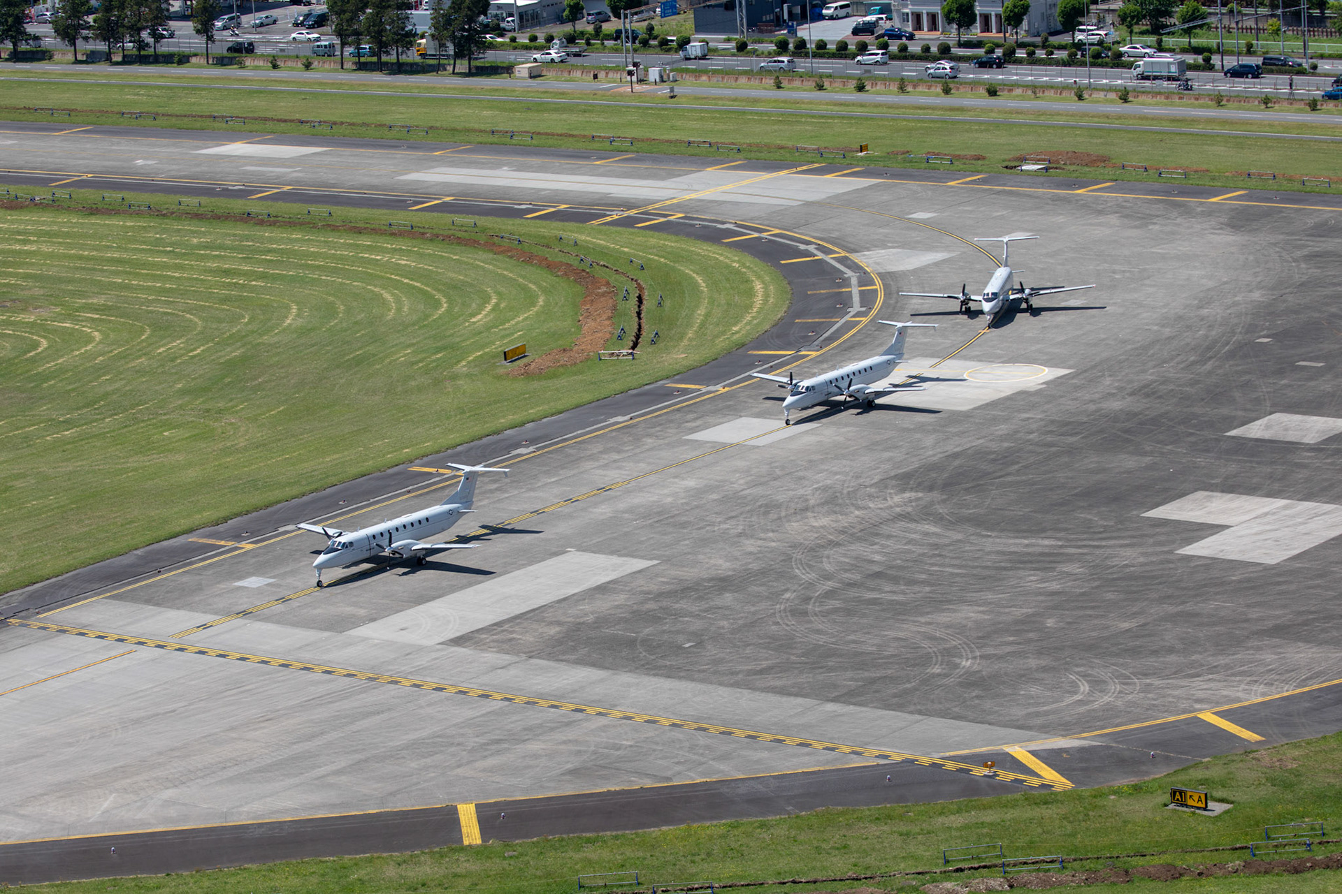 Three C-12 Hurons from the 459th Airlift Squadron take part in an elephant walk before taking off during the 374th Airlift Wing (AW) Generation Exercise at Yokota Air Base, Japan, May 4, 2018. The 374th AW conducted the exercise to train the wing’s ability to rapidly provide humanitarian aid and disaster relief throughout the Indo-Pacific region. (U.S. Air Force photo by Yasuo Osakabe)