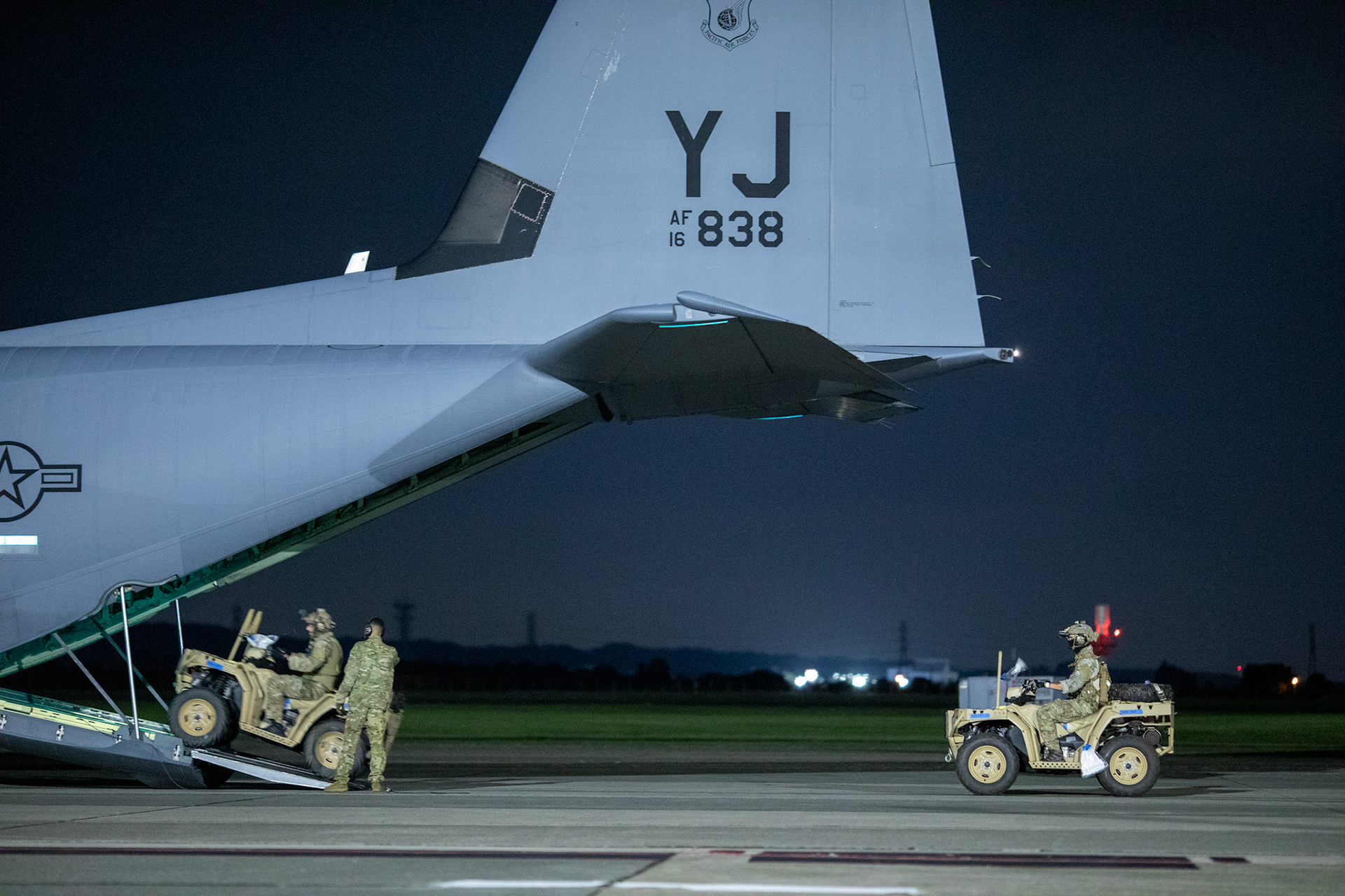 U.S. Air Force Special Tactics operators with the 320th Special Tactics Squadron out of Kadena Air Base, Japan, wait to load their tactical vehicles into a C-130J Super Hercules during an engine running onload/offload (ERO) training as part of Exercise Gryphon Jet at Yokota Air Base, Japan, June 23, 2020. Special Tactics is a U.S. Special Operation Command's tactical air and ground integration force, and the Air Force's special operations ground force, leading Global Access, Precision Strike, Personnel Recovery and Battlefield Surgery operations on the battlefield. Exercise Gryphon Jet is an integrated training exercise focused on improving interoperability throughout the special operations community. (U.S. Air Force photo by Yasuo Osakabe)