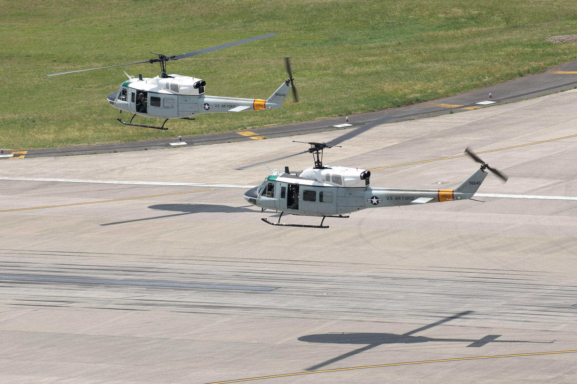 Two UH-1N Iroquois helicopters, assigned to the 459th Airlift Squadron, fly in formation during the 374th Airlift Wing (AW) Generation Exercise Elephant Walk at Yokota Air Base, Japan, May 4, 2018. The 374th AW conducted the exercise to train the wing’s ability to rapidly provide humanitarian aid and disaster relief throughout the Indo-Pacific region. (U.S. Air Force photo by Yasuo Osakabe)