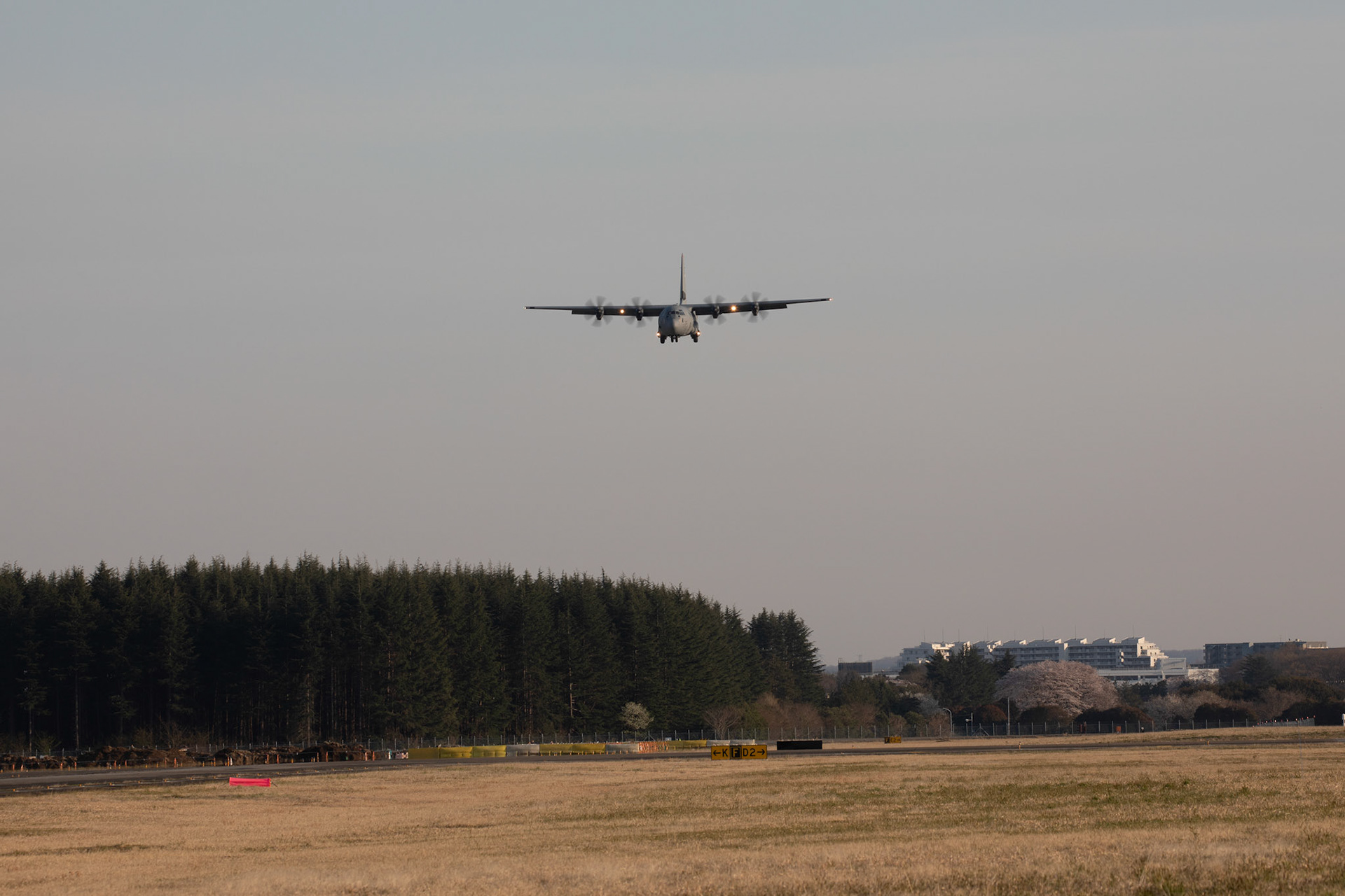 A C-130J Super Hercules assigned to the 36th Airlift Squadron approaches Foxtrot taxiway at Yokota Air Base, Japan, March 26, 2020. A C-130J used Foxtrot taxiway here as a landing zone for an assault landing for the first time. Training like this ensures the mission can continue at the Yokota airfield despite any potential setbacks that impact operations to the main runway. (U.S. Air Force photo by Yasuo Osakabe)
