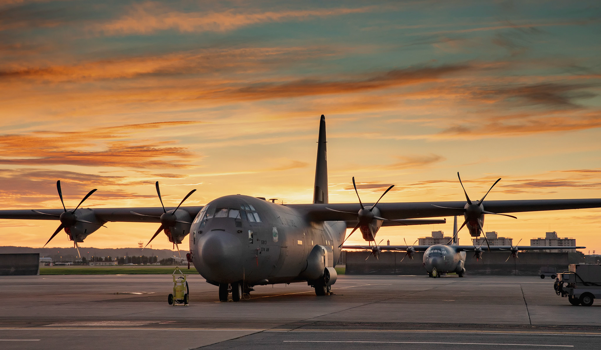 The early morning sunrise highlights a C-130J Super Hercules assigned to the 36th Airlift Squadron at Yokota Air Base, Japan, Aug. 15, 2018.  A reddish sky around sunrise means a lot of water vapor already present in the atmosphere. (U.S. Air Force photo by Yasuo Osakabe)