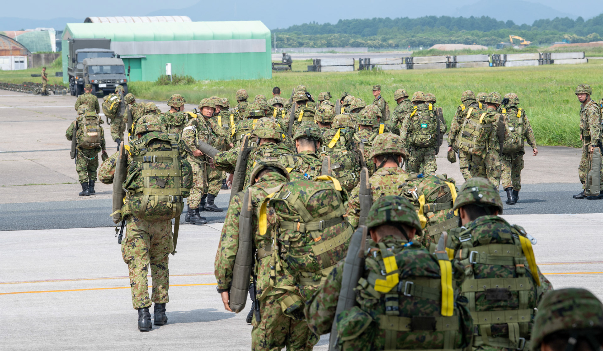 Japan Ground Self-Defense Force soldiers with the 1st Airborne Brigade get off a U.S. Air Force C-130J Super Hercules assigned to the 36th Airlift Squadron at Japan Air Self-Defense Force Tsuiki Air Base, Japan, July 16, 2019, during a bilateral jump training. The training allows USAF and JGSDF units to work alongside each other while improving the readiness of our armed forces. (U.S. Air Force photo by Yasuo Osakabe)