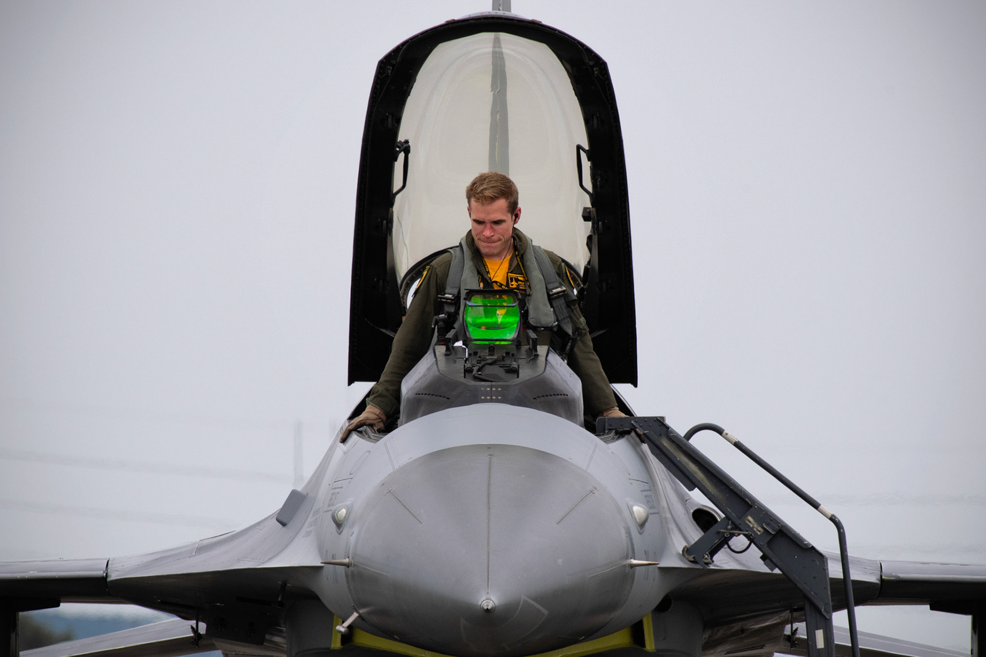U.S. Air Force Capt. Kyle Rasmussen, 80th Fighter Squadron F-16 flighting falcon pilot, exits a cockpit after performing a F-16 Fly-by during the 2019 Japanese- American Friendship Festival, Sept. 14, 2019. The festival gives community members a chance to come onto Yokota to see static aircraft, witness military demonstrations, learn about the capabilities and training done at Yokota and to meet with the service members who work and live on base. (U.S. Air Force photo by Yasuo Osakabe)
