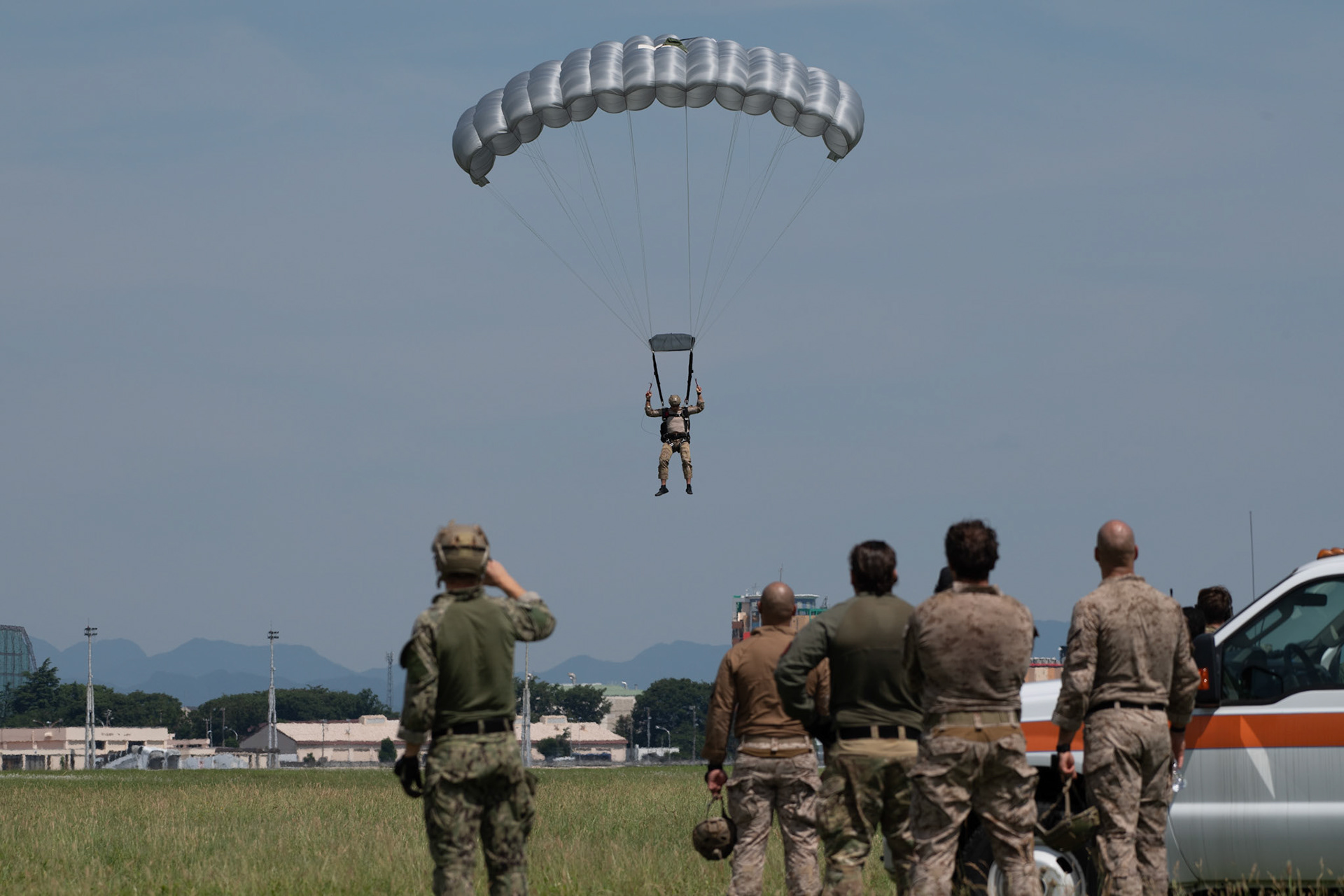 A member of U.S. Navy SEAL (Sea, Air and Land) Team One parachutes from a U.S. Air Force C-130J Super Hercules assigned to the 36th Airlift Squadron over Yokota Air Base, Japan, June 17, 2020, during Exercise Gryphon Jet. Gryphon Jet is an integrated training exercise focused on improving interoperability throughout the special operations community. (U.S. Air Force photo by Yasuo Osakabe)
