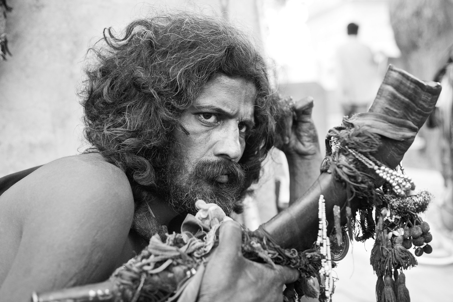 He is a malang, which means Sadhu, where live in Mian meer darbar. He is adoption of the characteristic malang, use of cannabis as a sacred sacrament. (Travel)