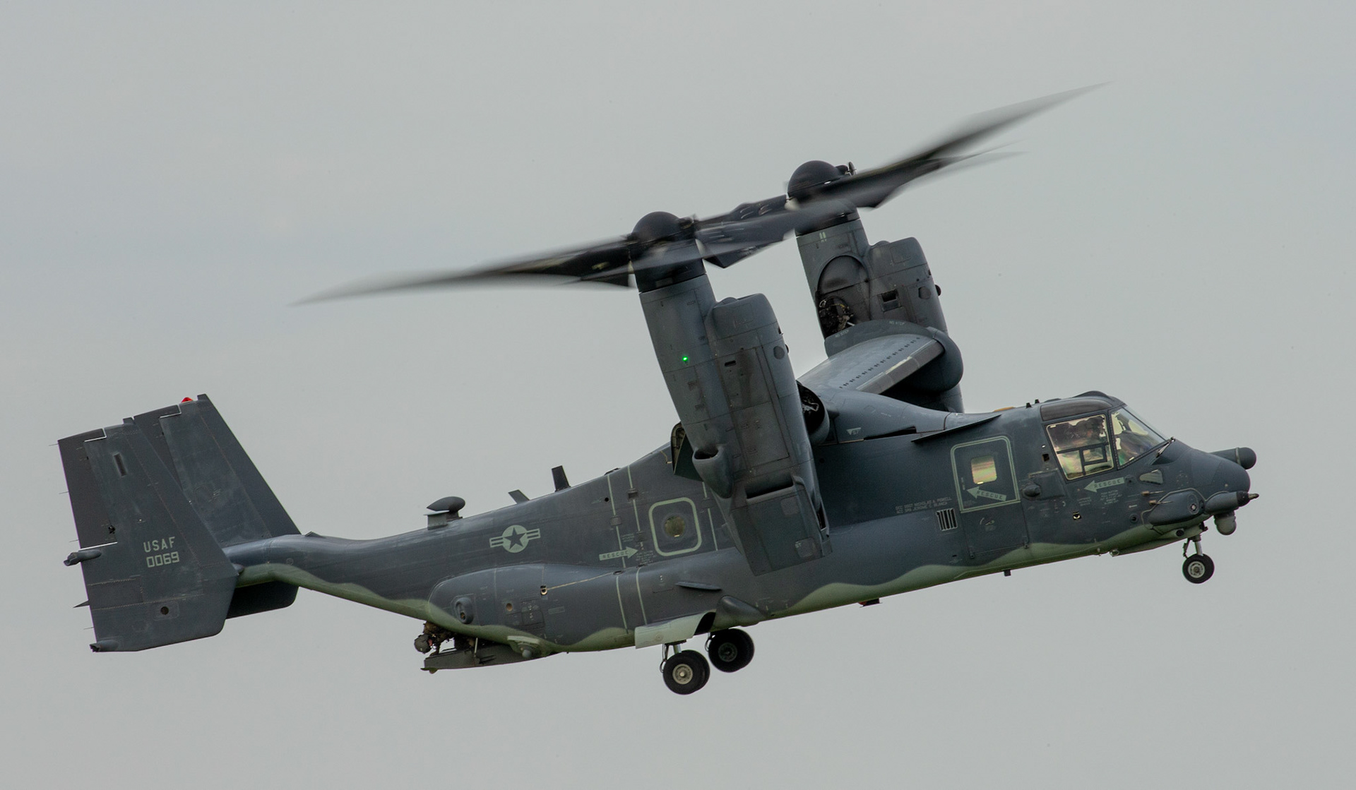 An Air Force special mission aviator with the 21st Special Operations Squadron conducts visual confirmation after takeoff at Yokota Air Base, Japan, June 15, 2020, during Exercise Gryphon Jet. Gryphon Jet is an integrated training exercise focused on improving interoperability throughout the special operations community. (U.S. Air Force photo by Yasuo Osakabe)