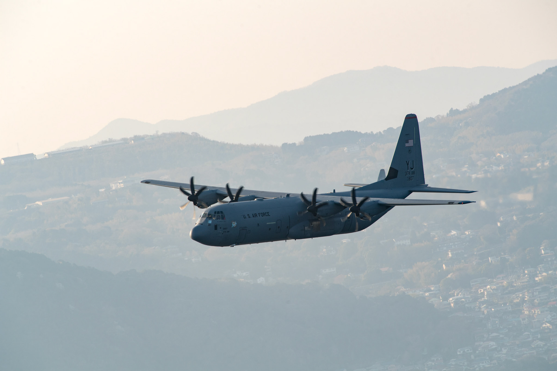 A U.S. Air Force C-130J Super Hercules assigned to the 36th Airlift Squadron flies during a training mission over Izu Peninsula, Japan, March 26, 2018. The C-130J provides tactical airlift worldwide. Its flexible design allows it the capability to operate in austere environments. (U.S. Air Force photo by Yasuo Osakabe)