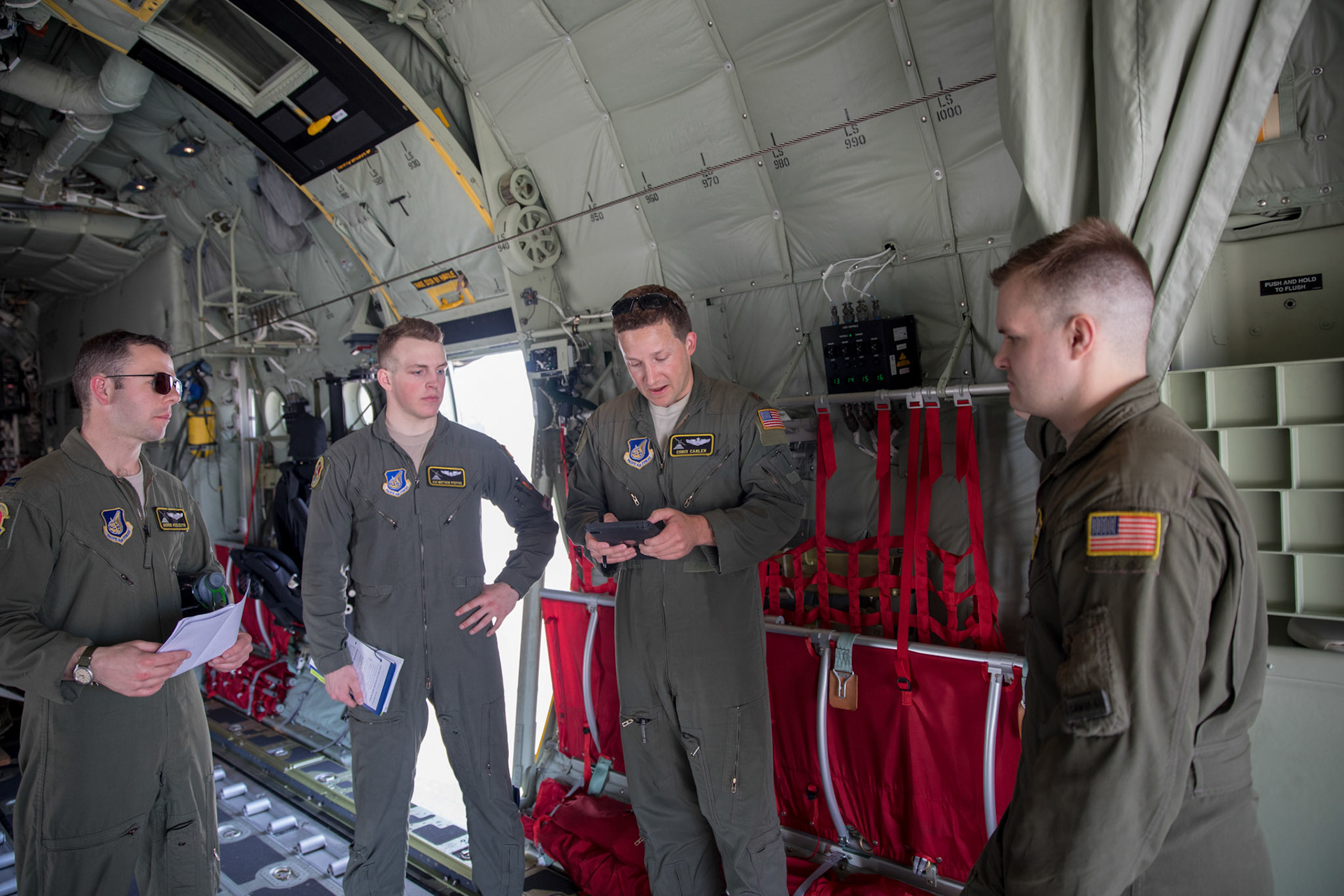 Maj. Christopher Carlen (center), 36th Airlift Squadron C-130J pilot, gives a pre-flight briefing at Yokota Air Base, Japan, March 26, 2018. The 36th AS Airmen trained on airdrops, flew with nigh vision goggles and performed tasks to prepare for U.S. Air Force peacetime and contingency operations. (U.S. Air Force photo by Yasuo Osakabe)