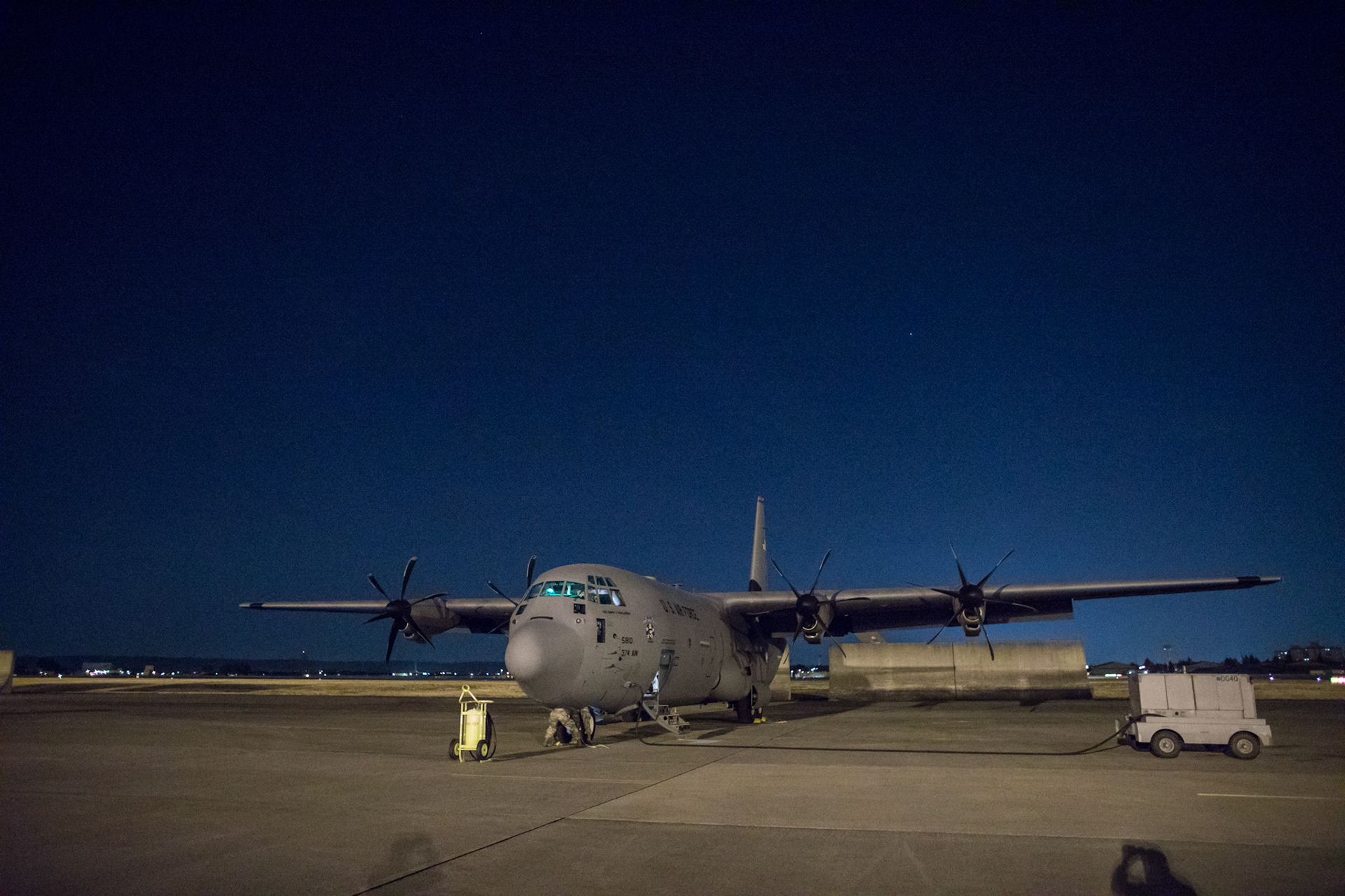 An Air Force C-130J Super Hercules parks on the flightline after returning a night training mission at Yokota Air Base, Japan, March 26, 2018. The C-130J assigned to the 36th Airlift Squadron regularly conducts training missions to remain proficient in necessary skills to support any contingency. (U.S. Air Force photo by Yasuo Osakabe)