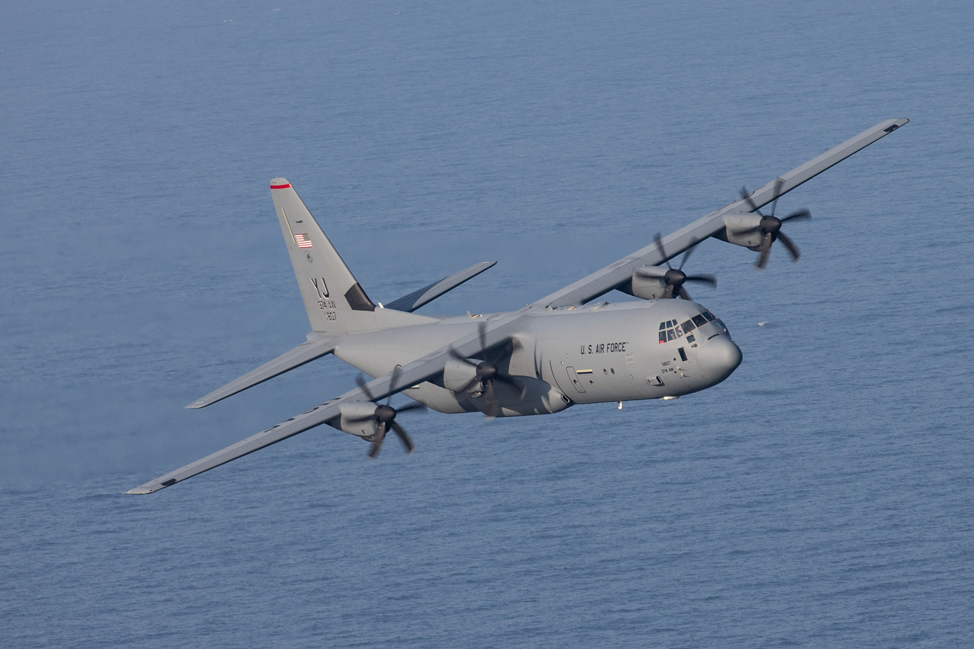 A U.S. Air Force C-130J Super Hercules assigned to the 36th Airlift Squadron flies over Suruga Bay, Japan, March 26, 2018. Performing regular in-flight operations gives all related personnel real-world experience to stay prepared for contingency situations and regular operations. (U.S. Air Force photo by Yasuo Osakabe)