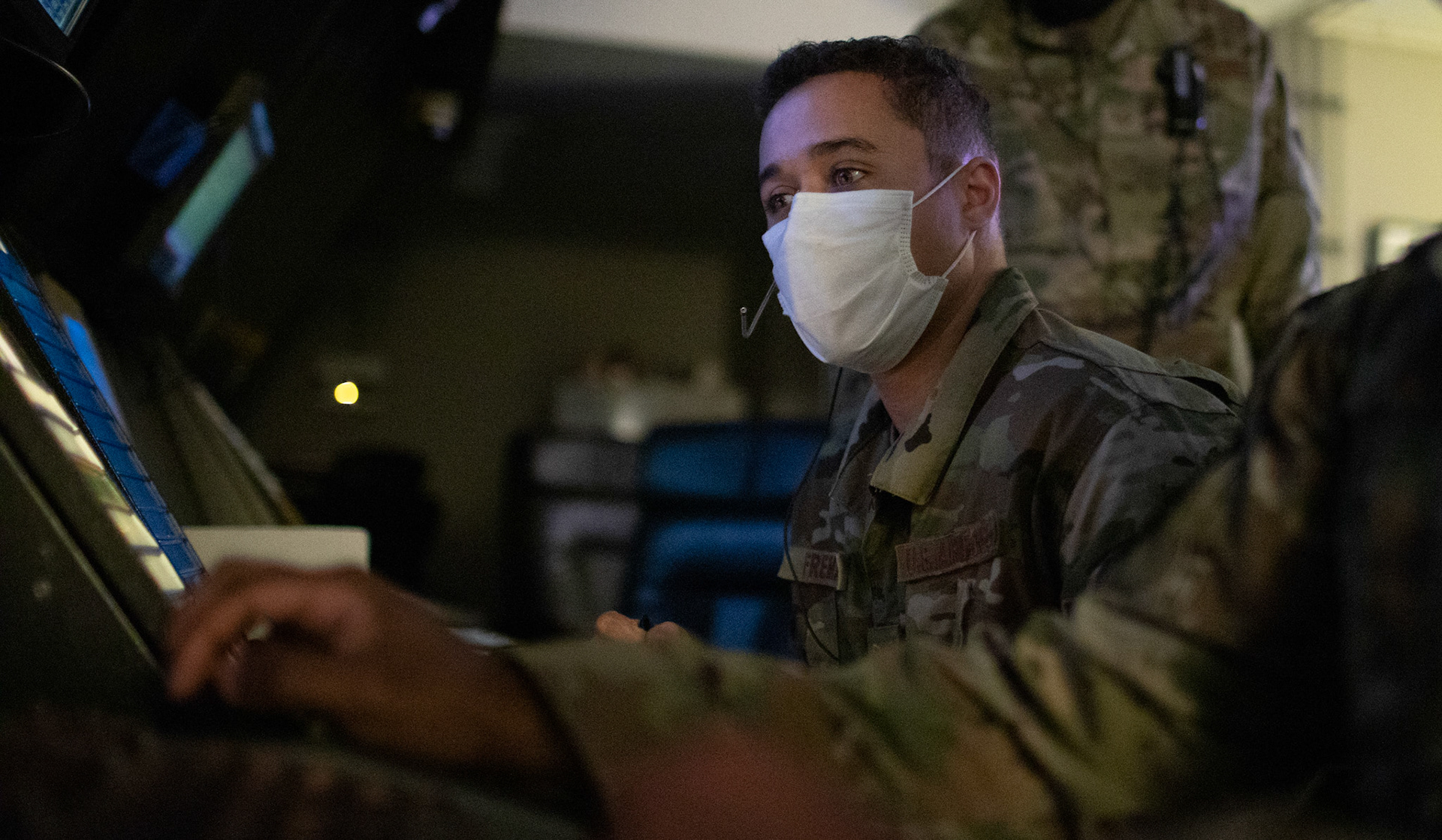 Tech. Sgt. James Freeman, 374th Operations Support Squadron air traffic control watch supervisor, reads flight paths to pilots via radio June 11, 2020, at Yokota Air Base, Japan. The radar approach control center operates 24/7, 365 days a year to direct all military and civilian aircraft traffic, including fixed-wing and rotary-wing aircraft from the ground to an altitude of 24,000 ft. (U.S. Air Force photo by Yasuo Osakabe)