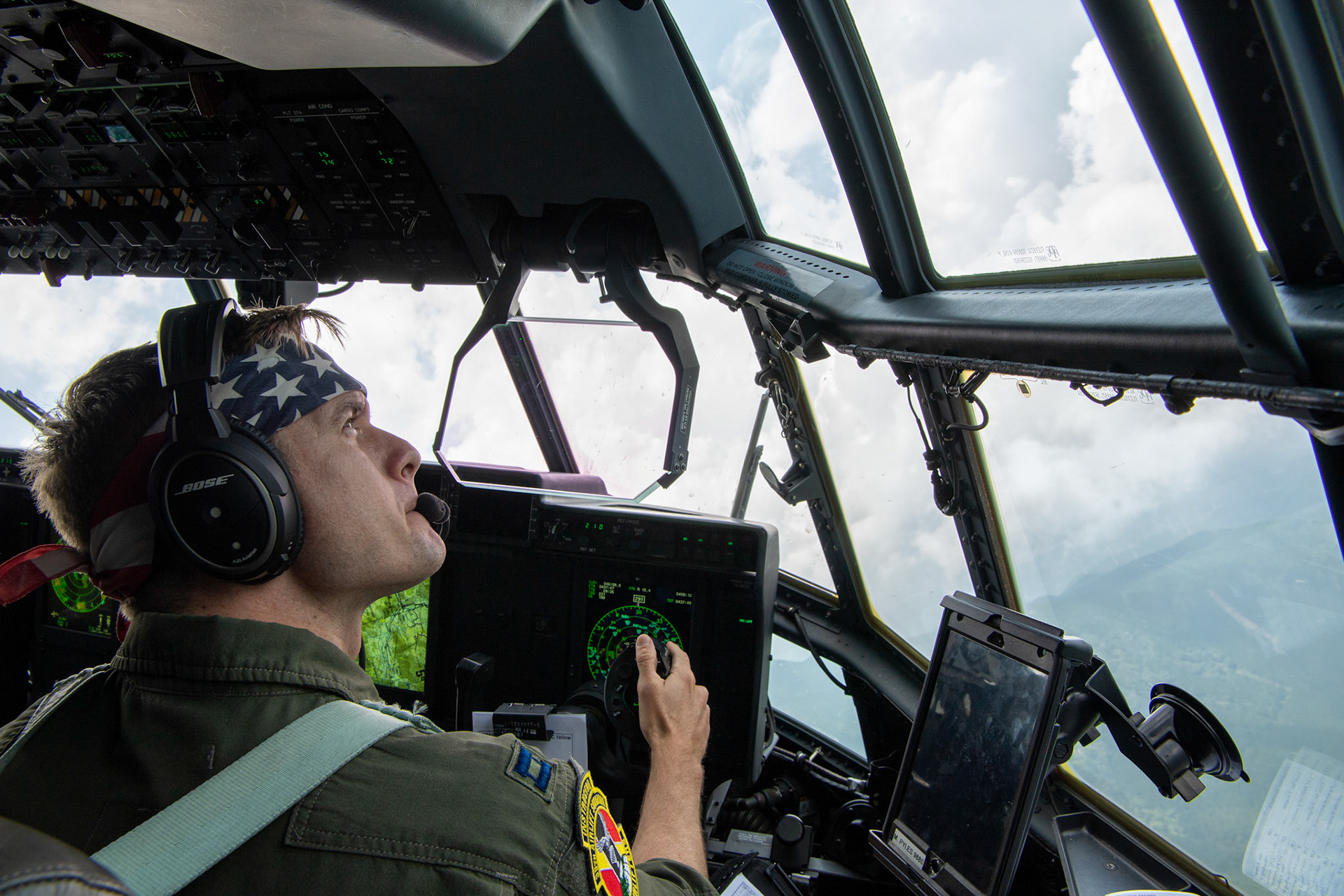U.S. Air Force Capt. Michael Pyles, 36th Airlift Squadron C-130J pilot, performs a visual confirmation over Mount Aso, Japan, July 16, 2019, during flight training mission. The training allows USAF and JGSDF units to work alongside each other while improving the readiness of our armed forces. (U.S. Air Force photo by Yasuo Osakabe)