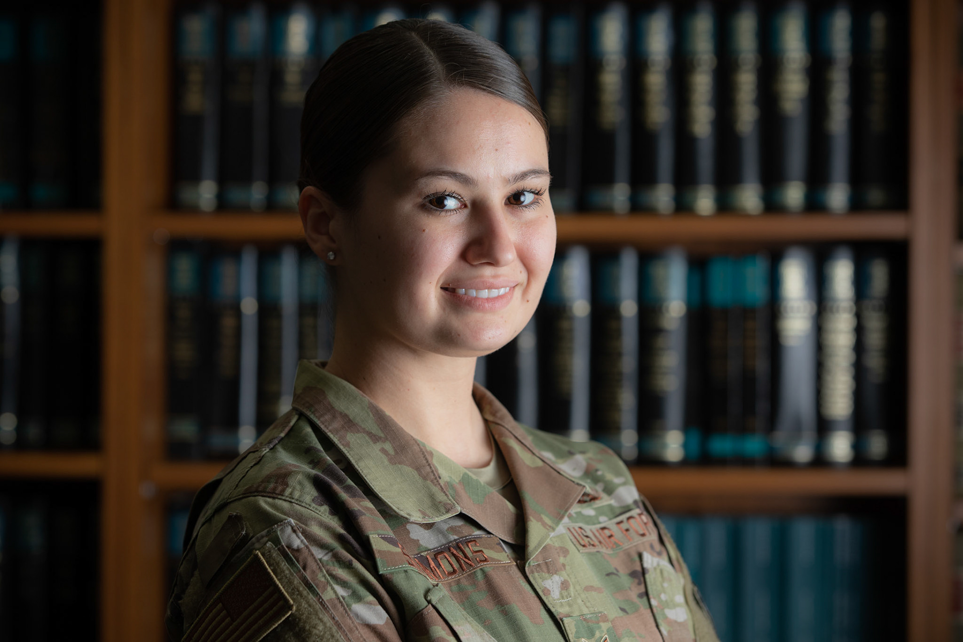 Airman 1st Class Mallory Simmons, 374th Airlift Wing judge advocate adverse actions paralegal, poses for an airlifter of the week portrait at Yokota Air Base, Japan, Aug. 25, 2020. Simmons is the “go-to” paralegal for adverse actions supporting five attorneys. Her dedication to Teamwork, Excellence, Attitude, and Mission (TEAM) is exemplified in her advisement to Yokota’s total force commanders and first sergeants on over 120 adverse actions. (U.S. Air Force photo by Yasuo Osakabe)