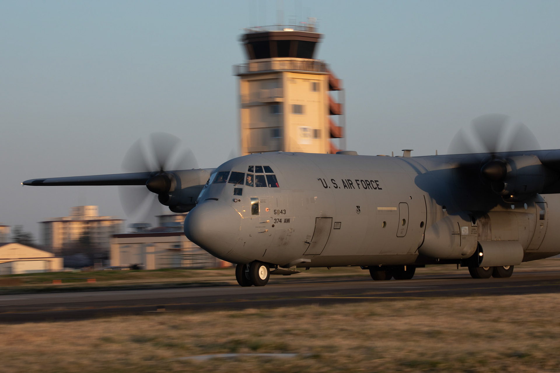 A C-130J Super Hercules assigned to the 36th Airlift Squadron lands on the Foxtrot taxiway at Yokota Air Base, Japan, March 26, 2020. A C-130J used Foxtrot taxiway here as a landing zone for an assault landing for the first time. Training like this ensures the mission can continue at the Yokota airfield despite any potential setbacks that impact operations to the main runway. (U.S. Air Force photo by Yasuo Osakabe)