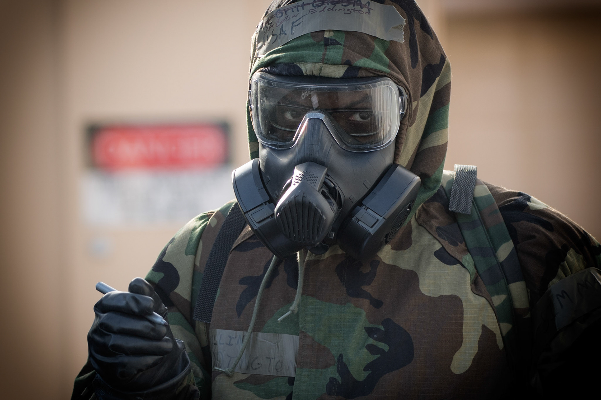 Senior Airman Collin Eddington, 374th Maintenance Squadron ISO aerospace maintenance apprentice, writes the date and time on a simulated M8 Chemical Agent Detection Paper during the Wartime Readiness Inspection at Yokota Air Base, Japan, Feb. 8, 2017. The inspection was designed to evaluate Yokota’s ability to provide airlift capabilities while responding to a variety of real-world scenarios. (U.S. Air Force photo by Yasuo Osakabe/Released)