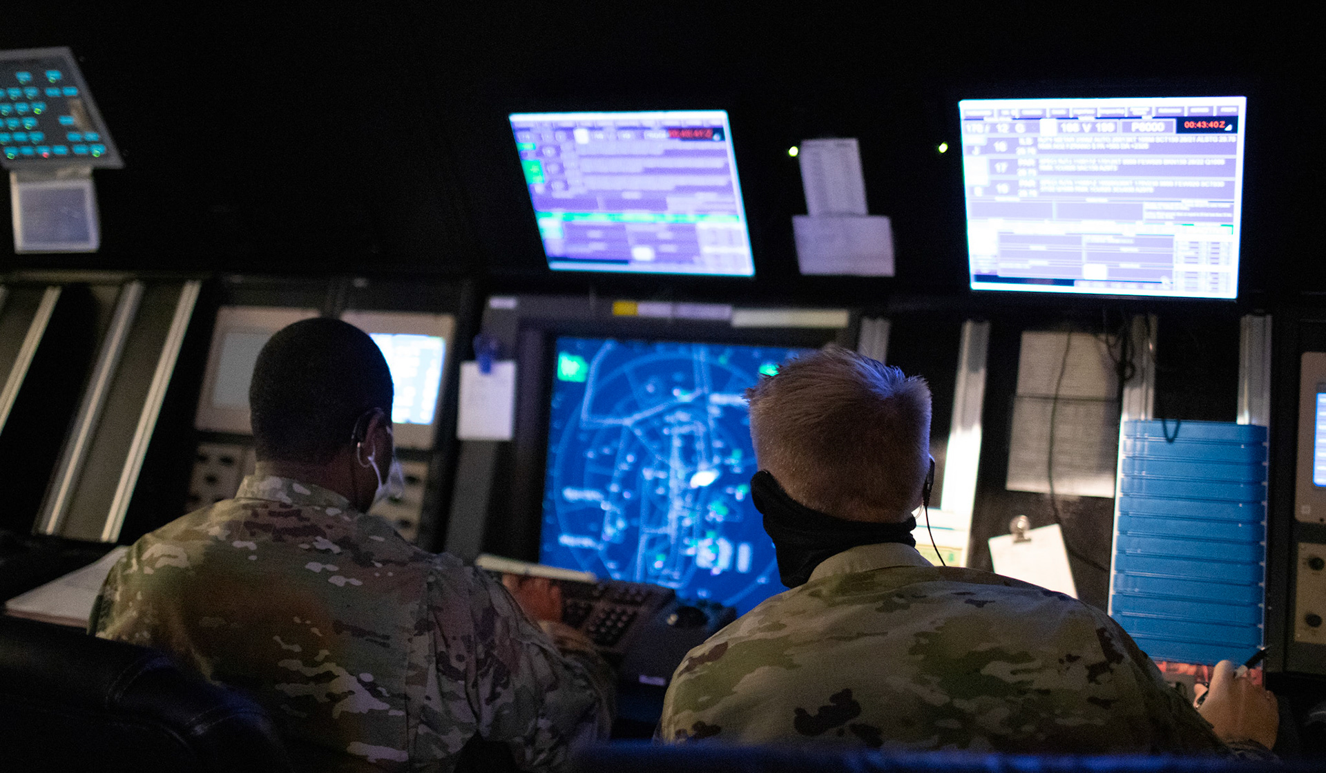 (Right to left) Tech. Sgt. James King and Staff Sgt. Marcus Jenkins, both 374th Operations Support Squadron radar approach control watch supervisors, perform daily operations with the RAPCON, June 11, 2020 at Yokota Air Base, Japan. Yokota's RAPCON members play a direct role in the wing's ability to conduct mission essential flight operations. (U.S. Air Force photo by Yasuo Osakabe)